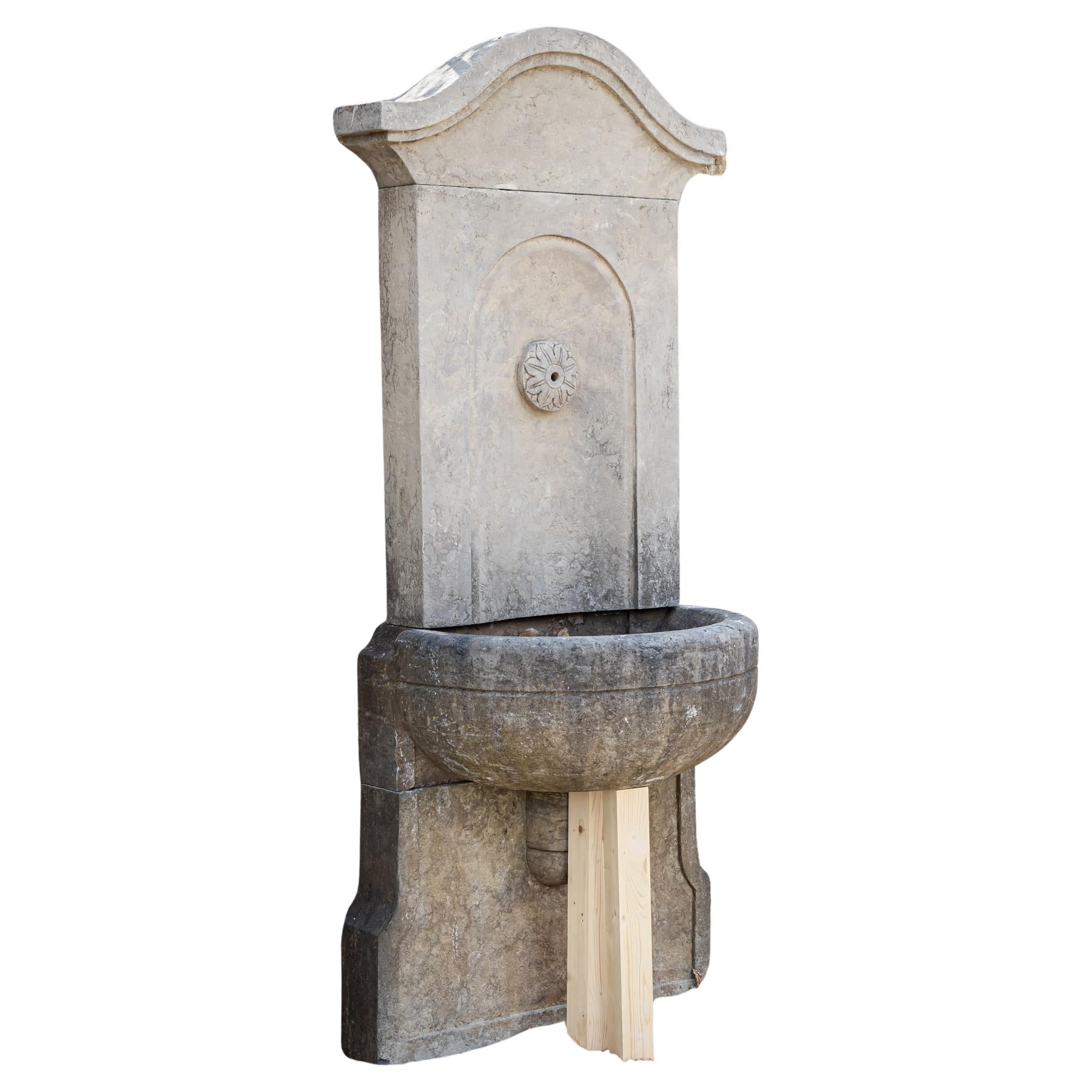 Antique-patinated Wall fountain