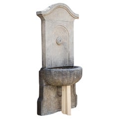 Antique-patinated Wall fountain