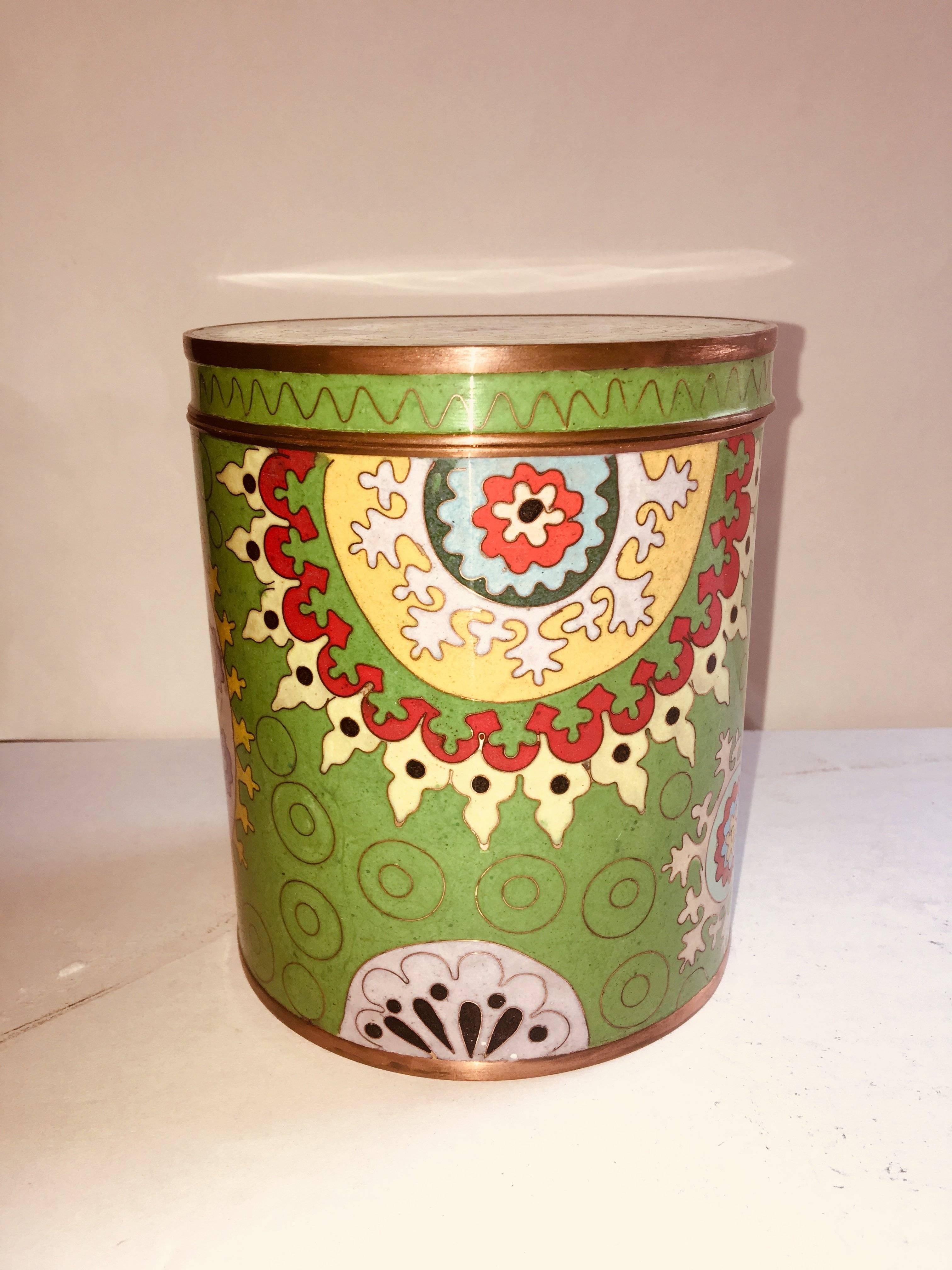 Antique patterned tin with top.