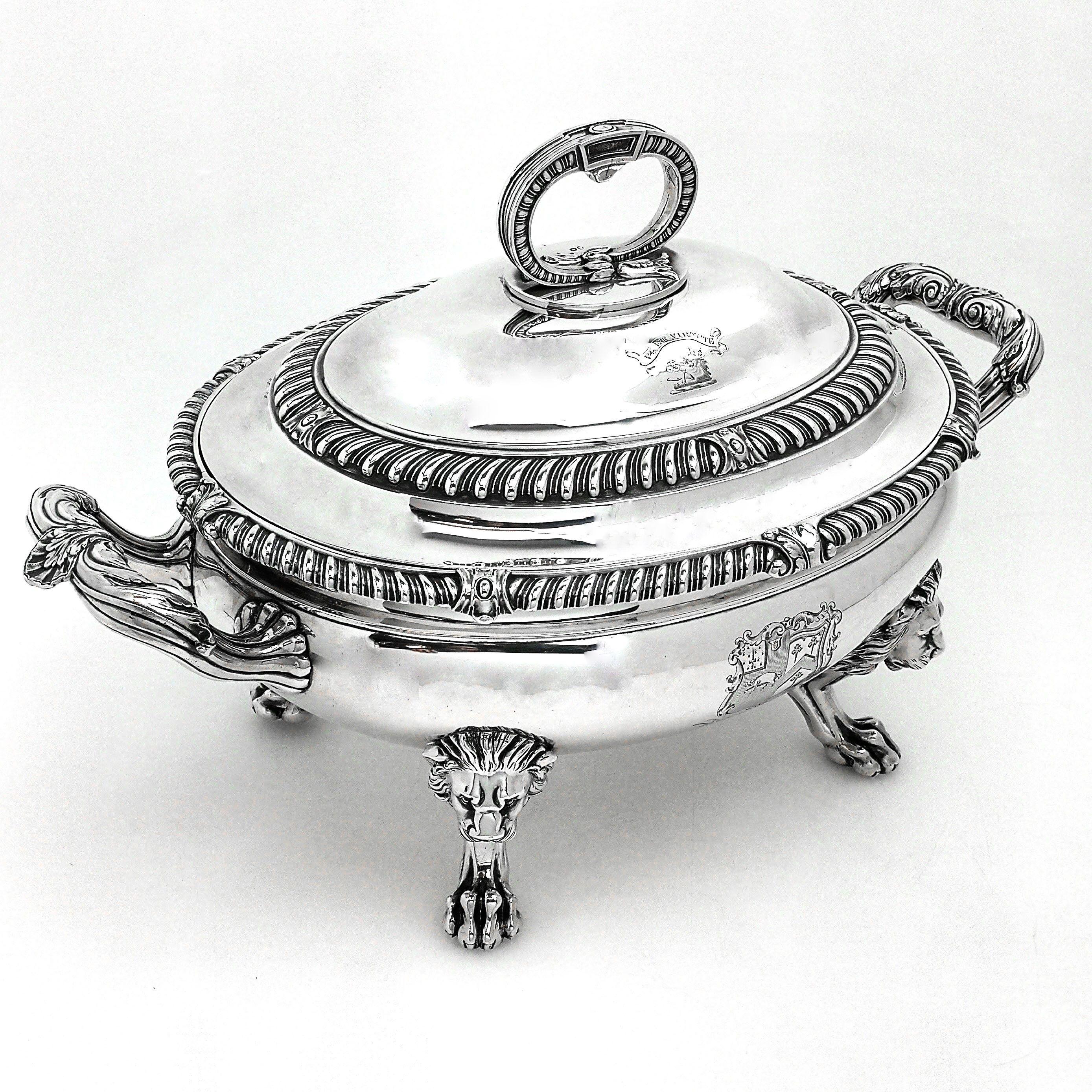 A magnificent Georgian solid Silver Soup Tureen by the esteemed Silversmith Paul Storr. This impressive oval shaped tureen stands on 4 lion head topped claw feet. The lid and body are decorated with classic gadroon pattern borders. Both lid and body