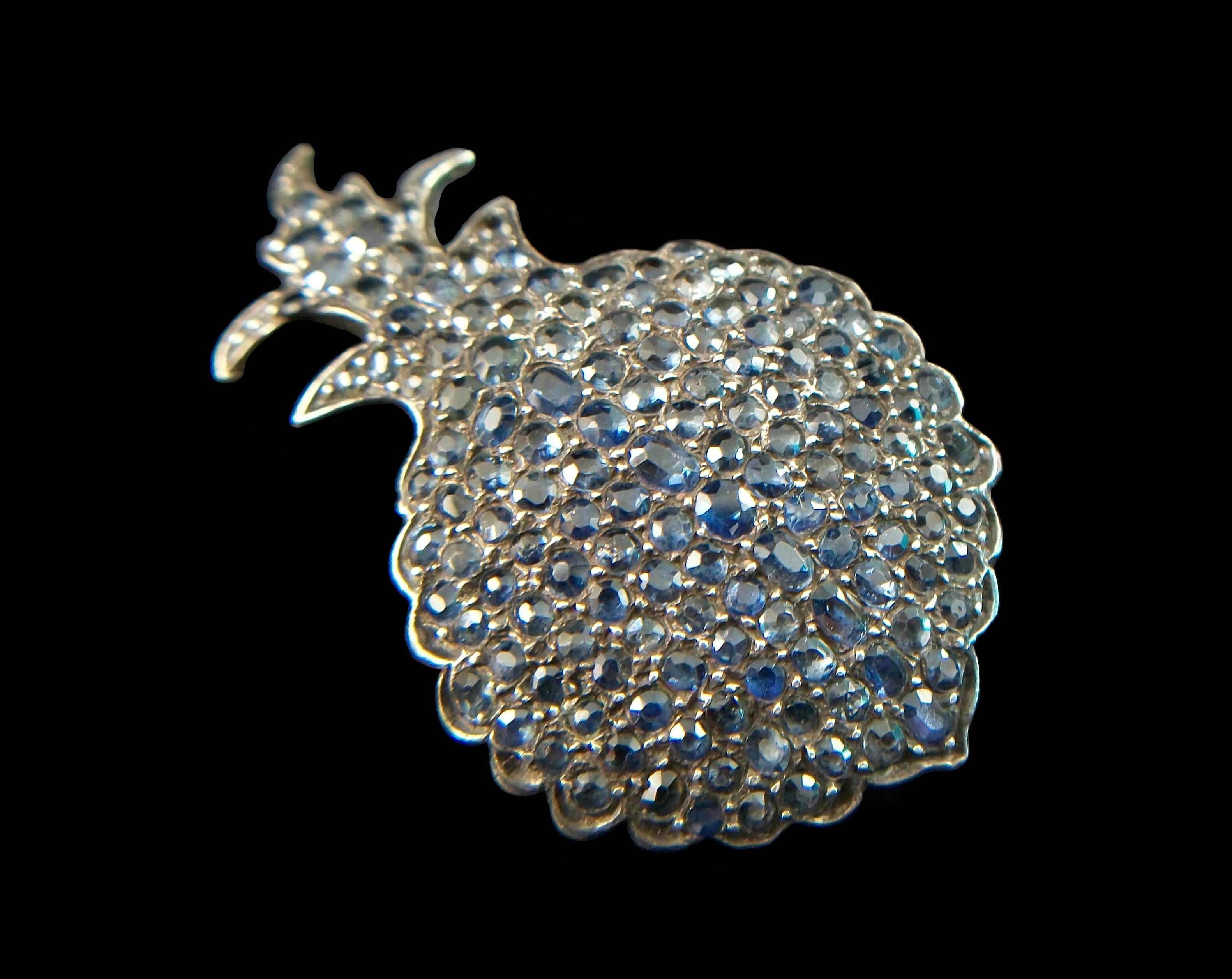 
Rare and impressive antique pavé set Sapphire convex pineapple brooch - featuring a cascade of old oval and round cut prong set sapphires (approx. 10.48 total carat weight - 143 sapphire count - the majority being 2.0 mm in diameter) - hand made