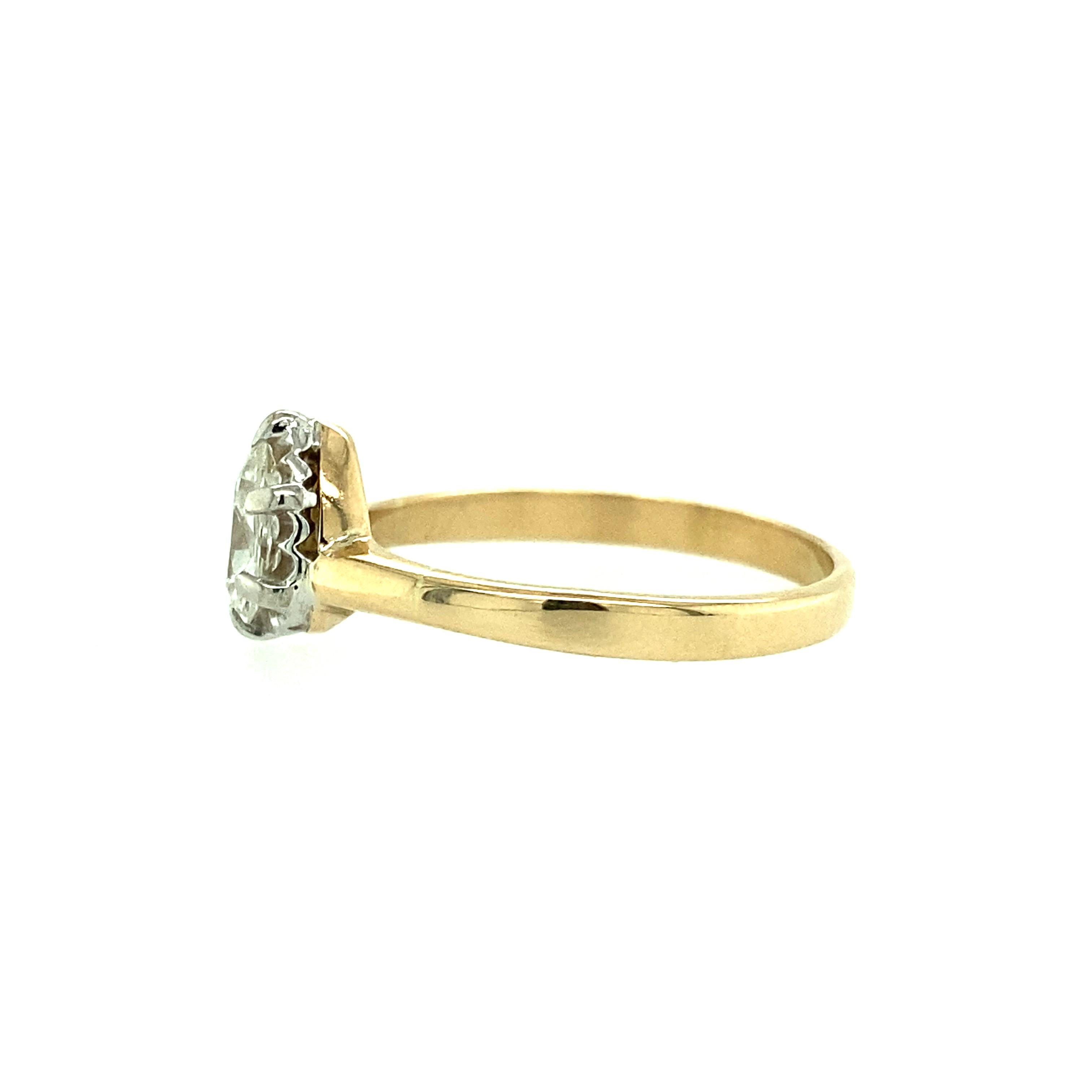 One estate 14 karat yellow and white gold diamond engagement ring set with one antique pear shaped diamond, 0.65 carat total with K color and I2 clarity.  The diamond is set in a 14 karat white gold six prong setting. There is a small chip on the