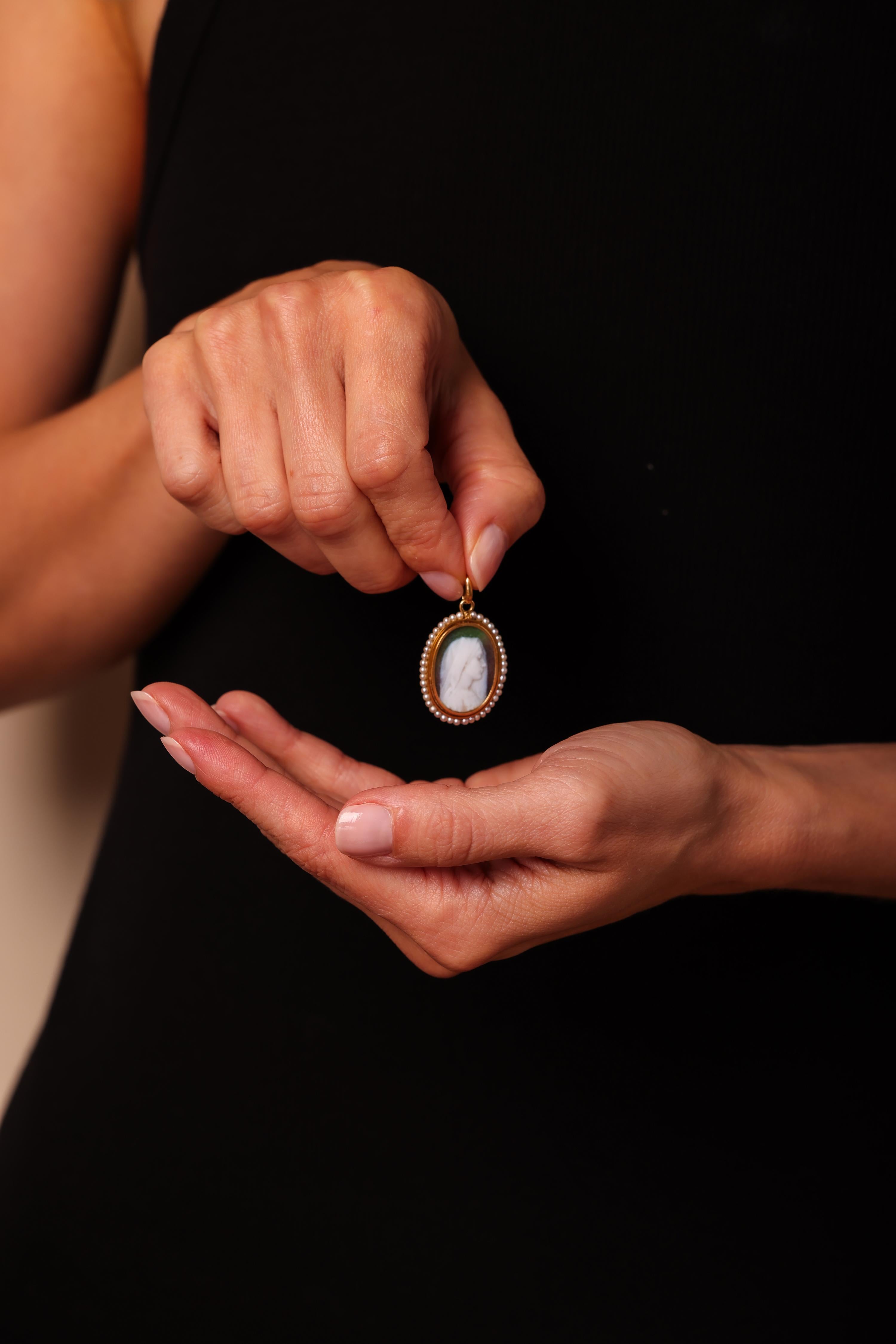 Center Stone: 42 Seed Pearls
Metal: 18K Yellow Gold
Era: Antique
Circa: 1900s
Size: 1 1/8 x 7/8 inches
Gram weight: 4.52


This antique pendant, dating back to the 1900s, is a stunning piece of jewelry featuring 42 seed pearls set in 18K yellow