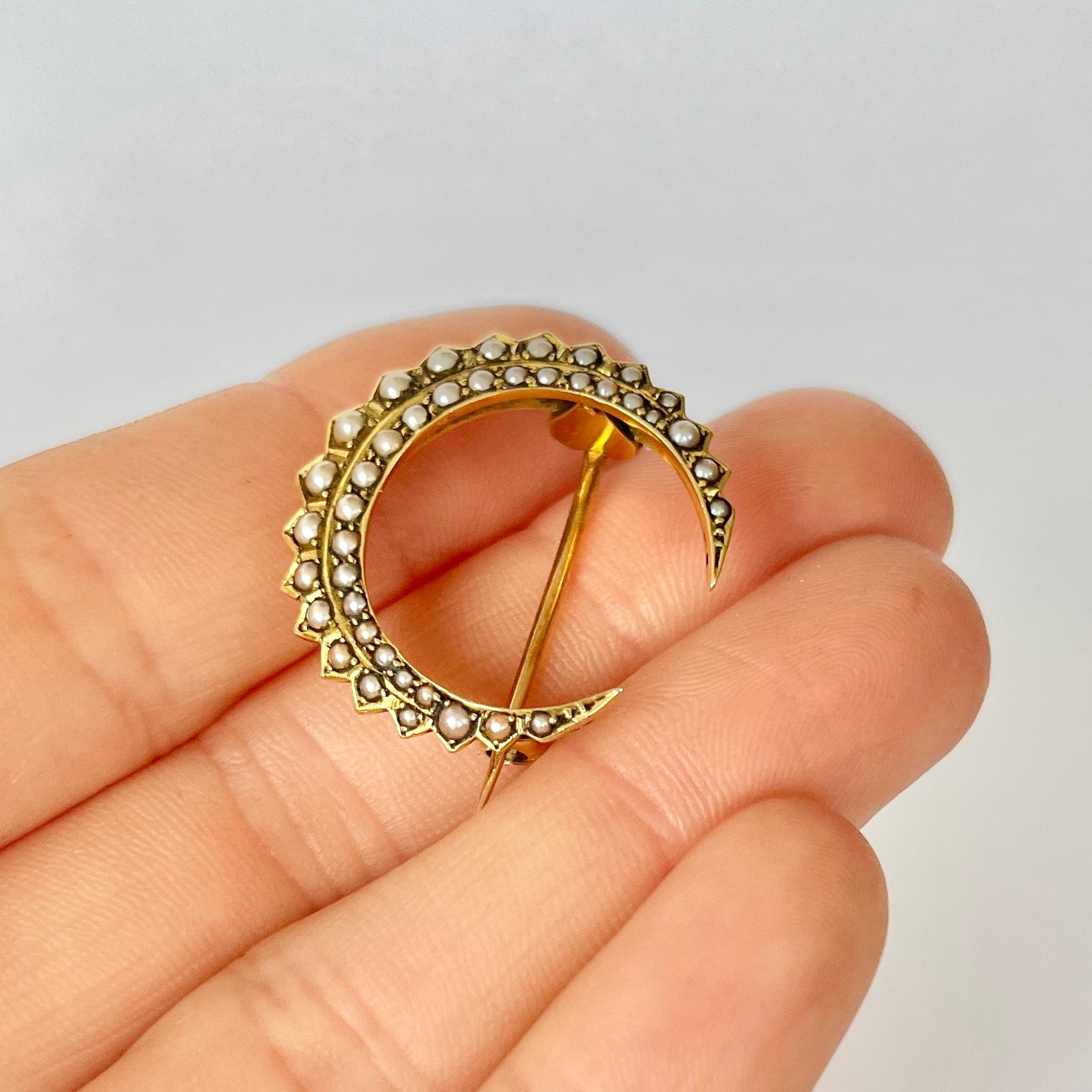 This fabulous crescent brooch has seed pearls set within the 9ct gold. I always like to mention that crescent brooches can be hooked onto a chain to make a gorgeous pendant. 

Crescent dimensions: 25x25mm 

Weight: 4.2g
