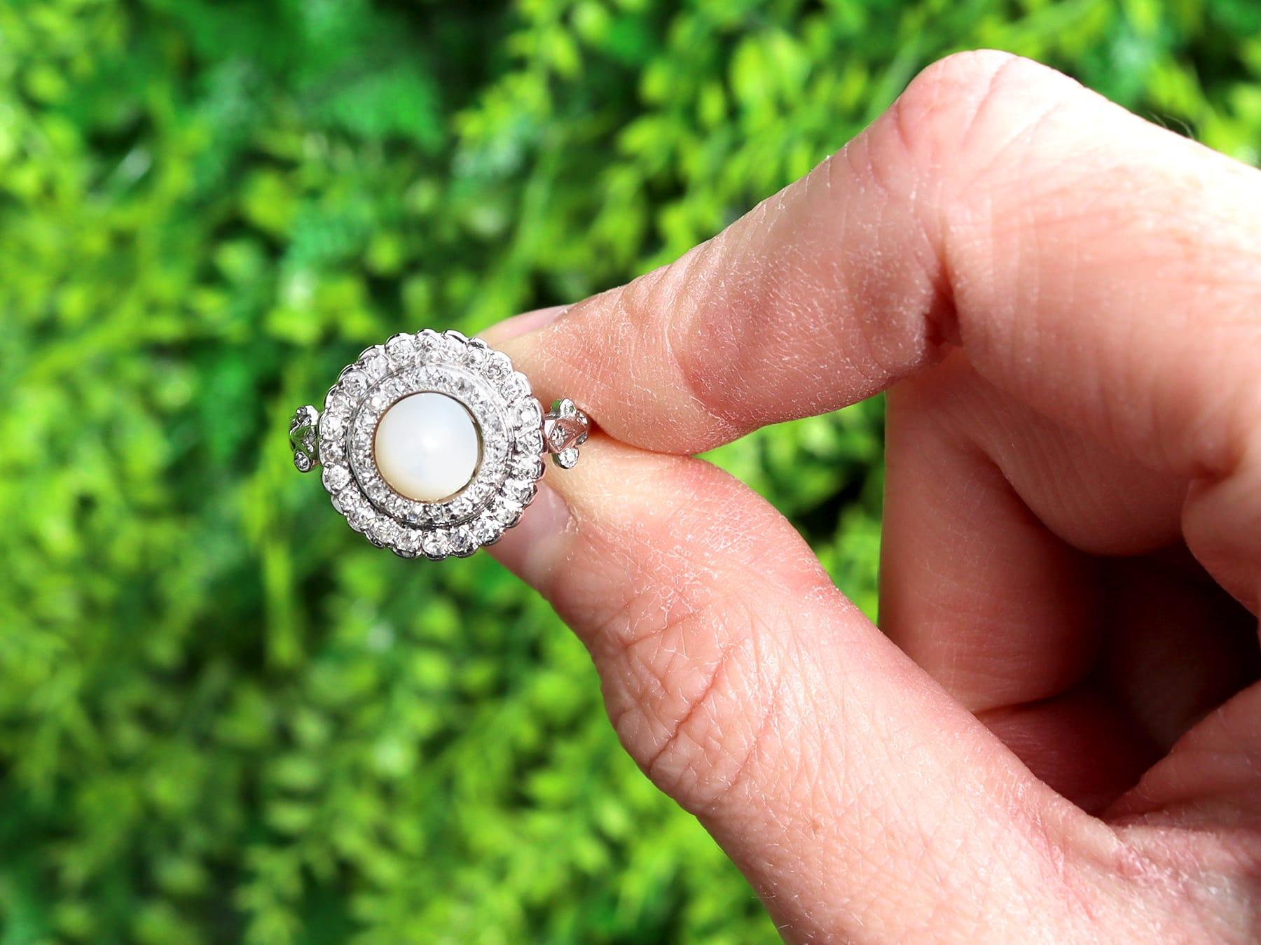 A fine and impressive antique 1910's pearl and 0.76 carat diamond, 18 karat white gold target ring; part of our diverse antique jewellery and estate jewelry collections.

This fine and impressive antique pearl ring has been crafted in 18k white
