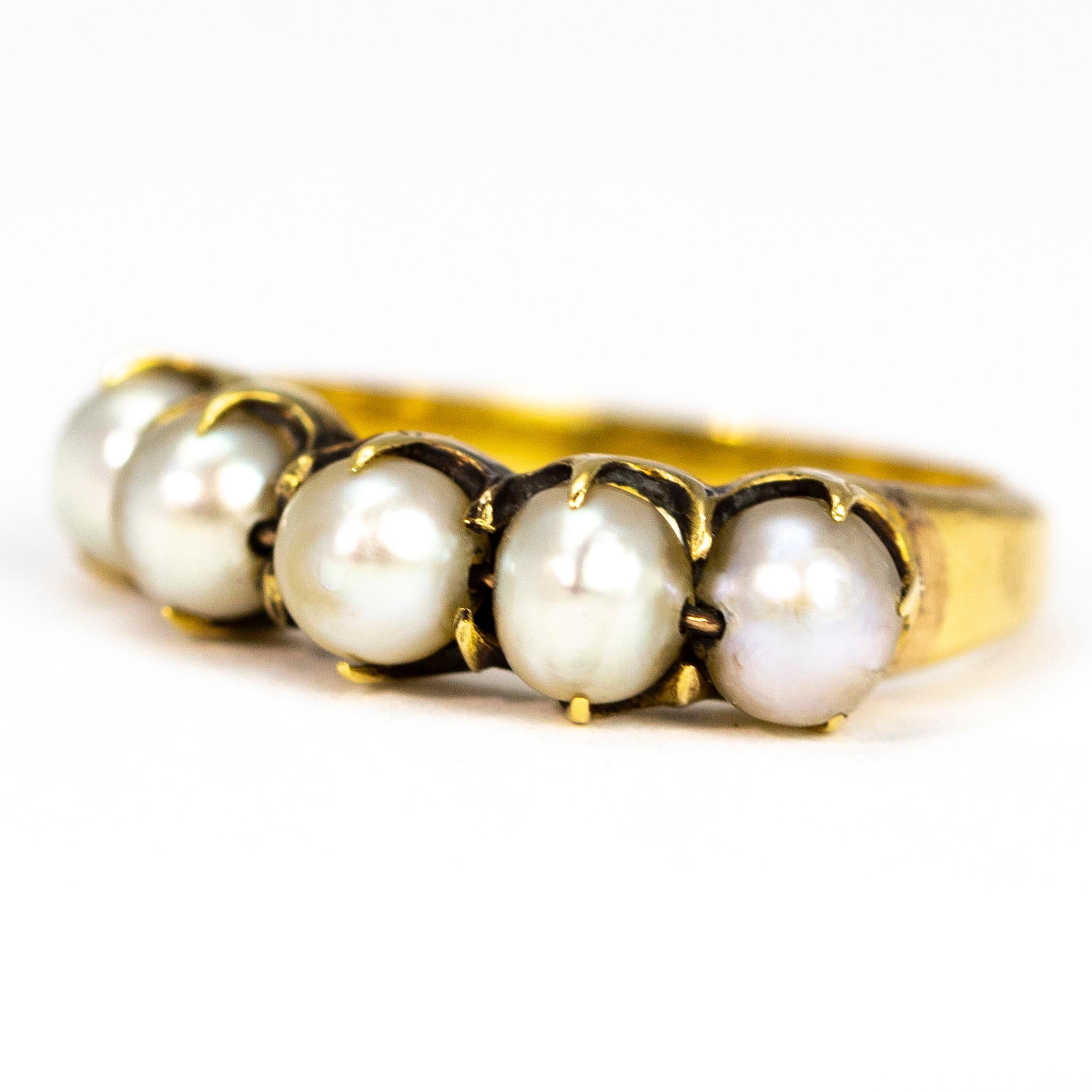The simple design of this ring is so pretty, the simple claws hold five beautiful glossy round pearls. The ring is modelled in 18ct gold. 

Ring Size: L or 5 3/4
Band Width: 5.5mm

Weight: 3.5g