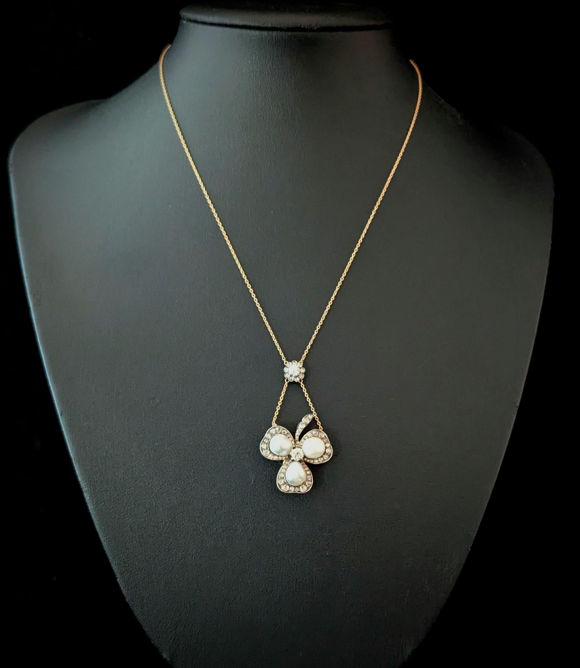 This is simply an impeccable antique piece, a real heirloom piece stacked with beauty and symbolism.

The shamrock can be removed and worn as a brooch and has a removable brooch fitting.

The shamrock is made up from three lustrous natural saltwater