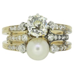 Anello antico con perle e diamanti a tre file