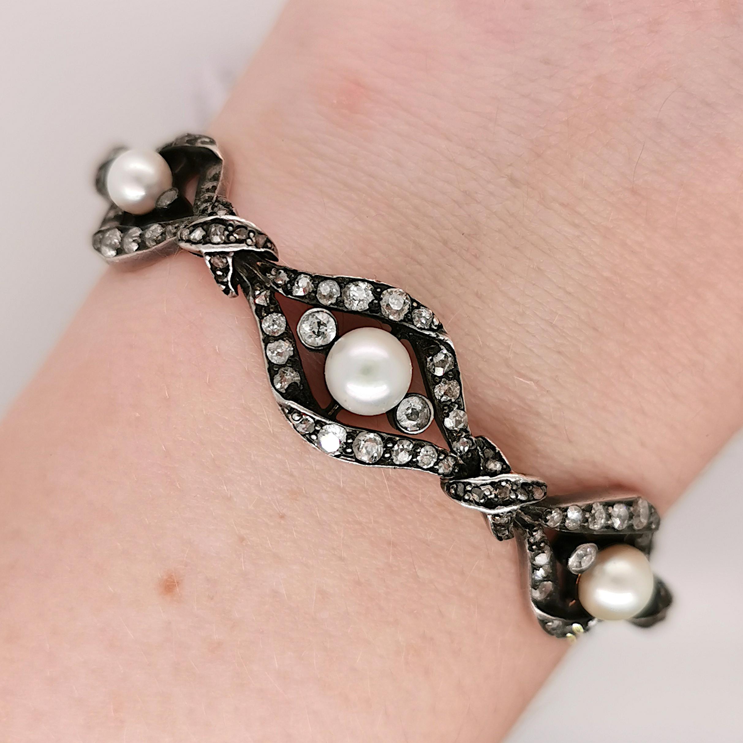 An antique, natural pearl and old-cut diamond bracelet, with eight links, with a natural pearl in the centre of each, measuring between 4-5mm, with a rub over set diamond either side and an old-cut diamond set twist surround, mounted in