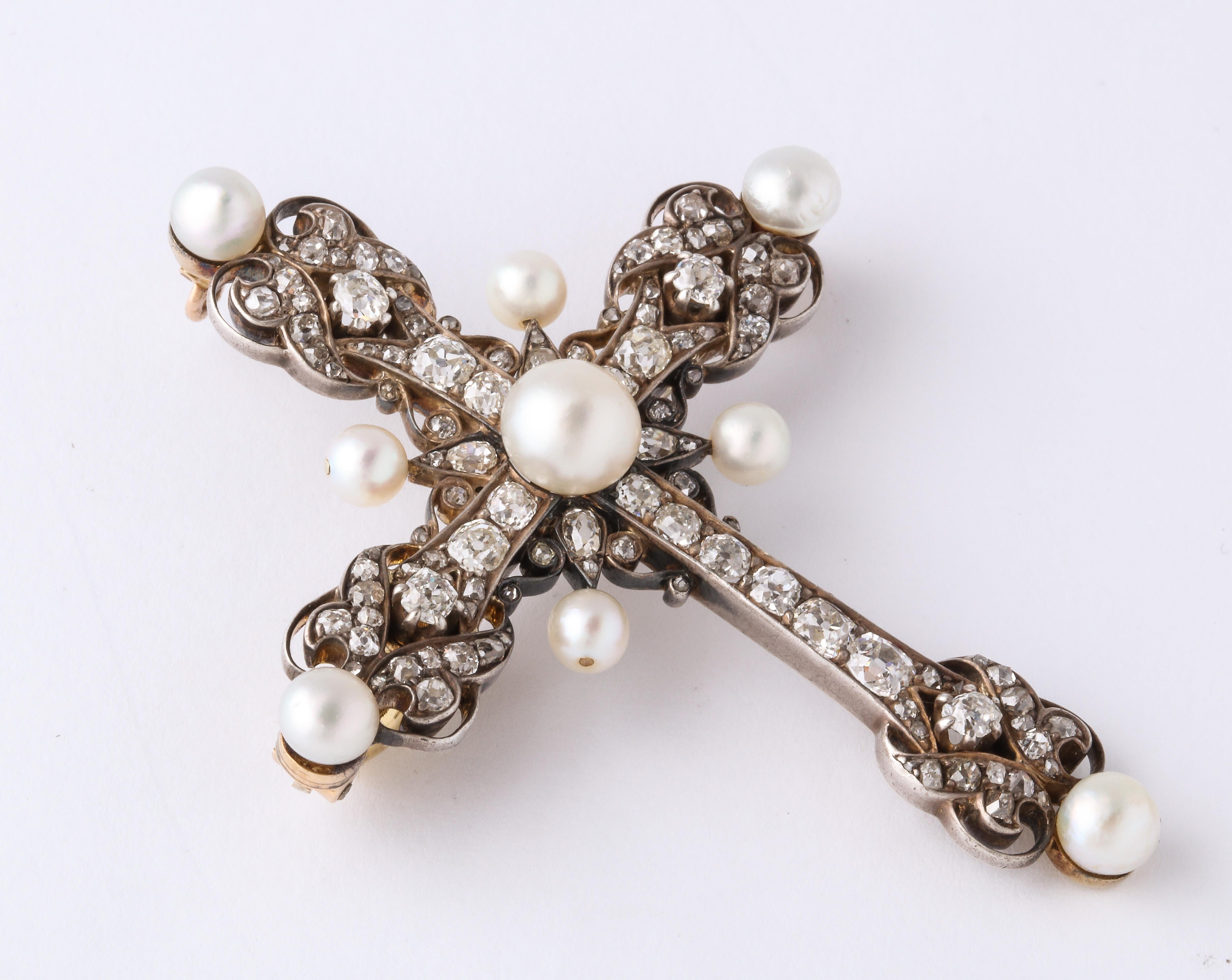 Antique Pearl and Diamond cross pendant pin, circa 1880.  14K White Gold with 85 old mine cut round diamonds totaling approximately 6.0 carats and 9 natural pearls.   1/2 inch high x 2 inches wide x 1/4 