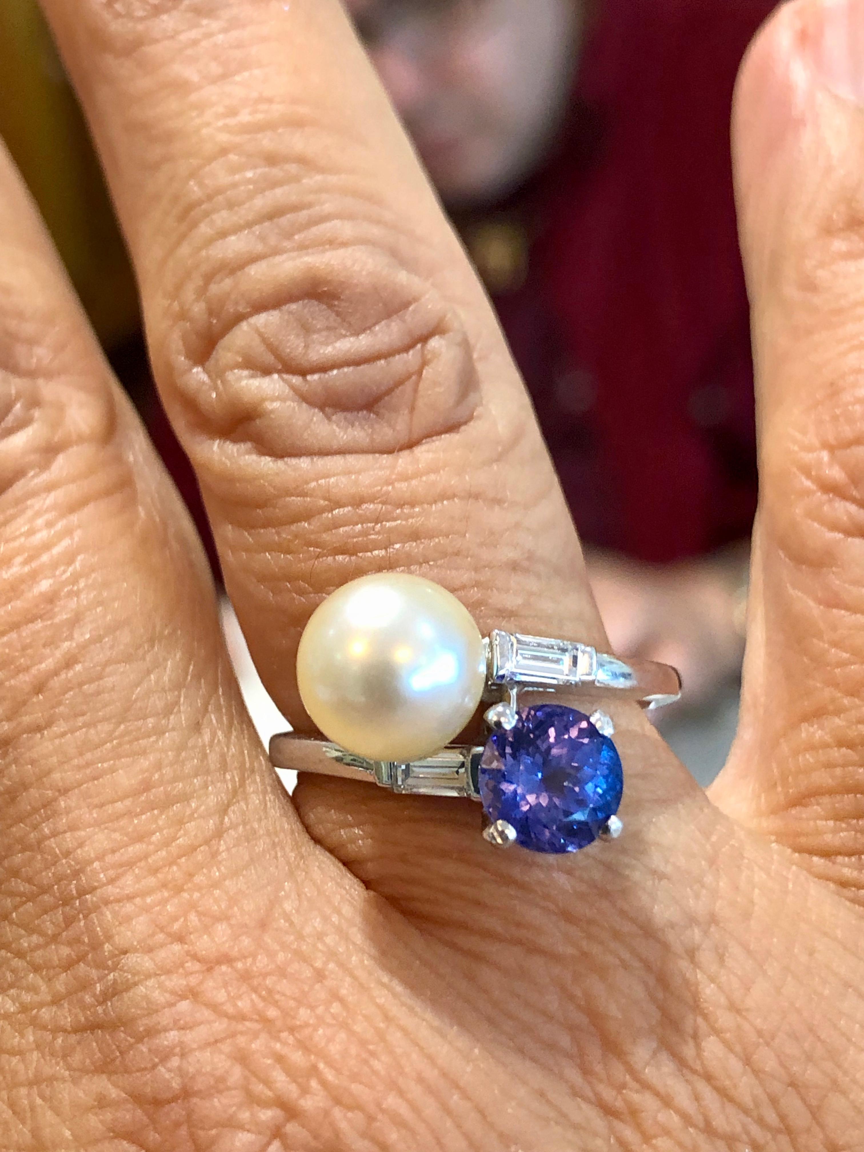 A fine antique Art Deco tanzanite, cultured pearl, and diamond platinum ring part of our fine vintage jewelry/estate jewelry collections This fine and impressive vintage pearl, tanzanite and diamond ring has been crafted in solid platinum. The 8.5mm