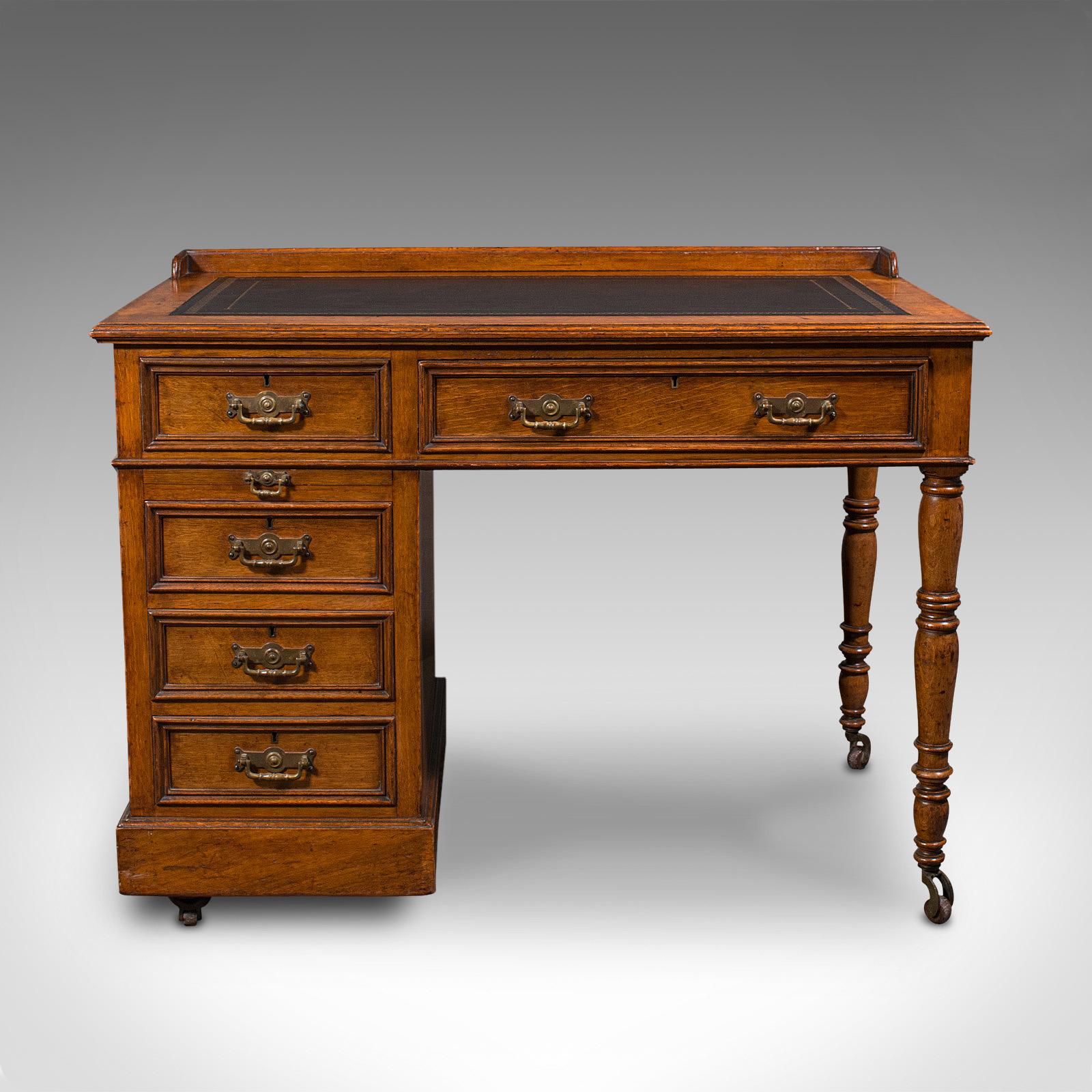 This is an antique pedestal desk. An English, oak and leather writing table, dating to the late Victorian period, circa 1880.

An attractive single pedestal desk offering fine colour and craftsmanship
Displays a desirable aged patina and in good