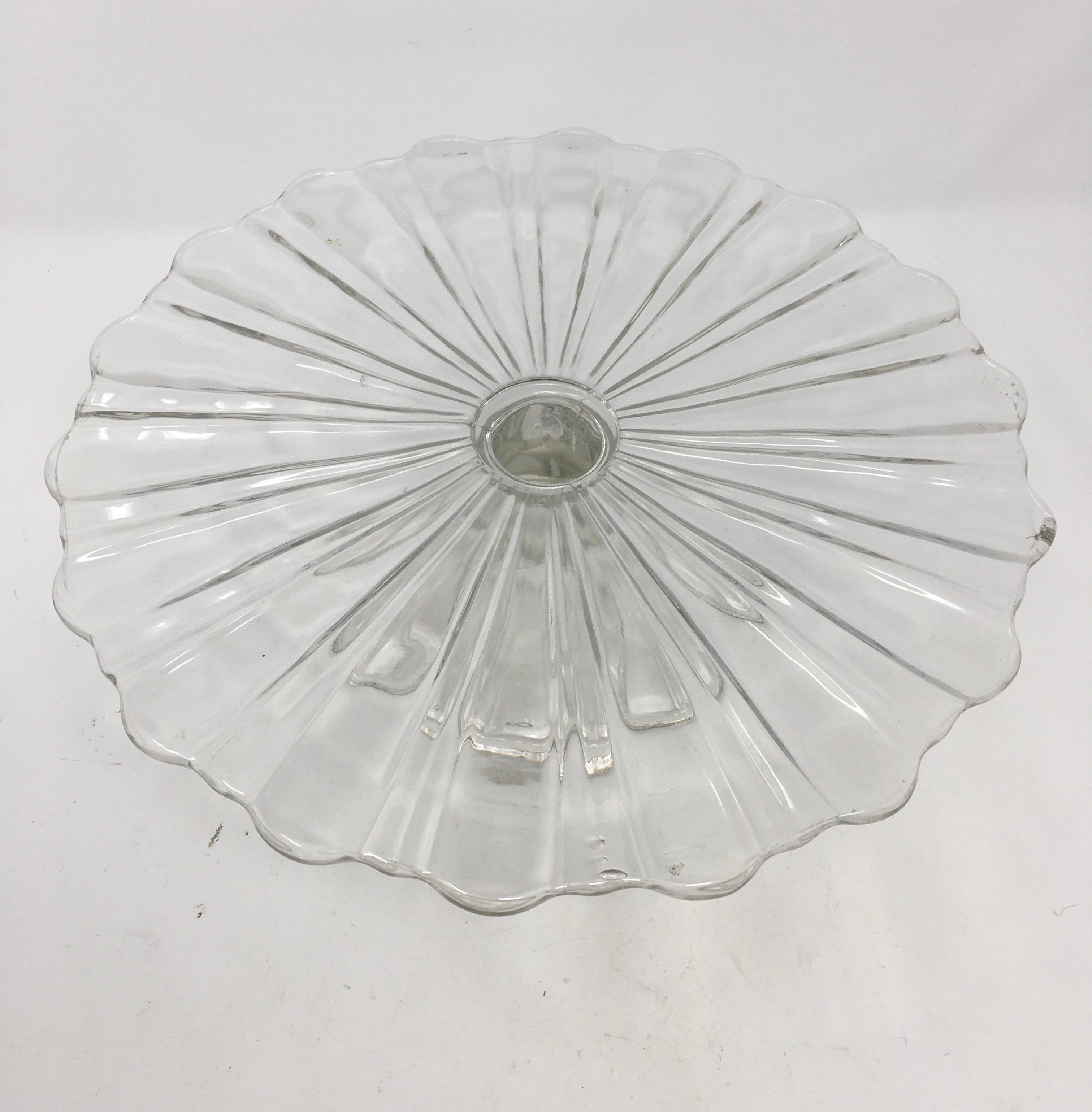 This antique cut glass cake patisserie stand sits on a cut glass pedestal base. Perfect for displaying your culinary confections, this piece’s simple, elegant look will mix with any decor.