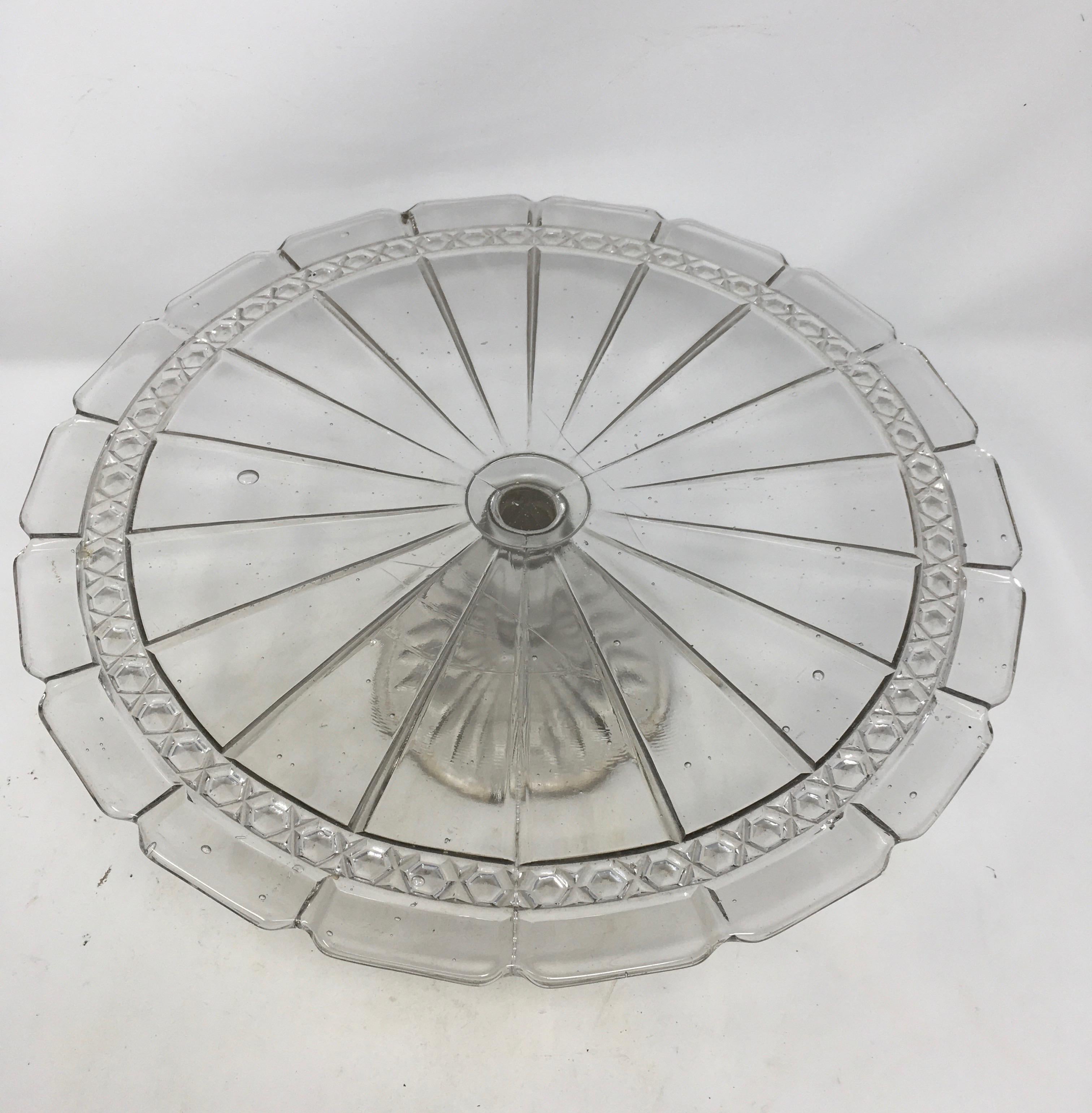 This antique cut-glass cake patisserie stand sits on a cut glass pedestal base. Perfect for displaying your culinary confections, this piece’s simple, elegant look will mix with any decor.

This piece weighs 5 lbs.