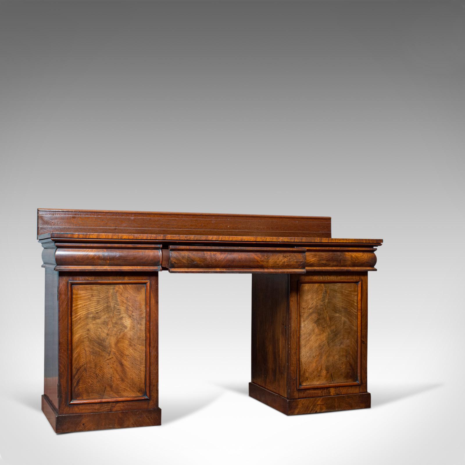 This is an antique pedestal sideboard. An English, mahogany and flame dresser dating to the Regency period, circa 1810.

Pedestal dresser displaying a desirable aged patina
Select mahogany and flame mahogany displays wonderful grain