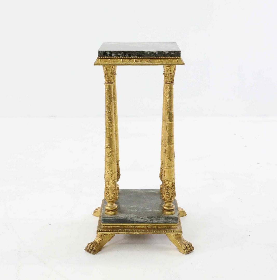 The pedestal on the four-legged stand, finial with a lion's paw. Two green marble slabs. To give an exclusive personality to your home decor as a decorative interior object.
This is a heavy marble and gilt metal pedestal, a mid-20th century stand in