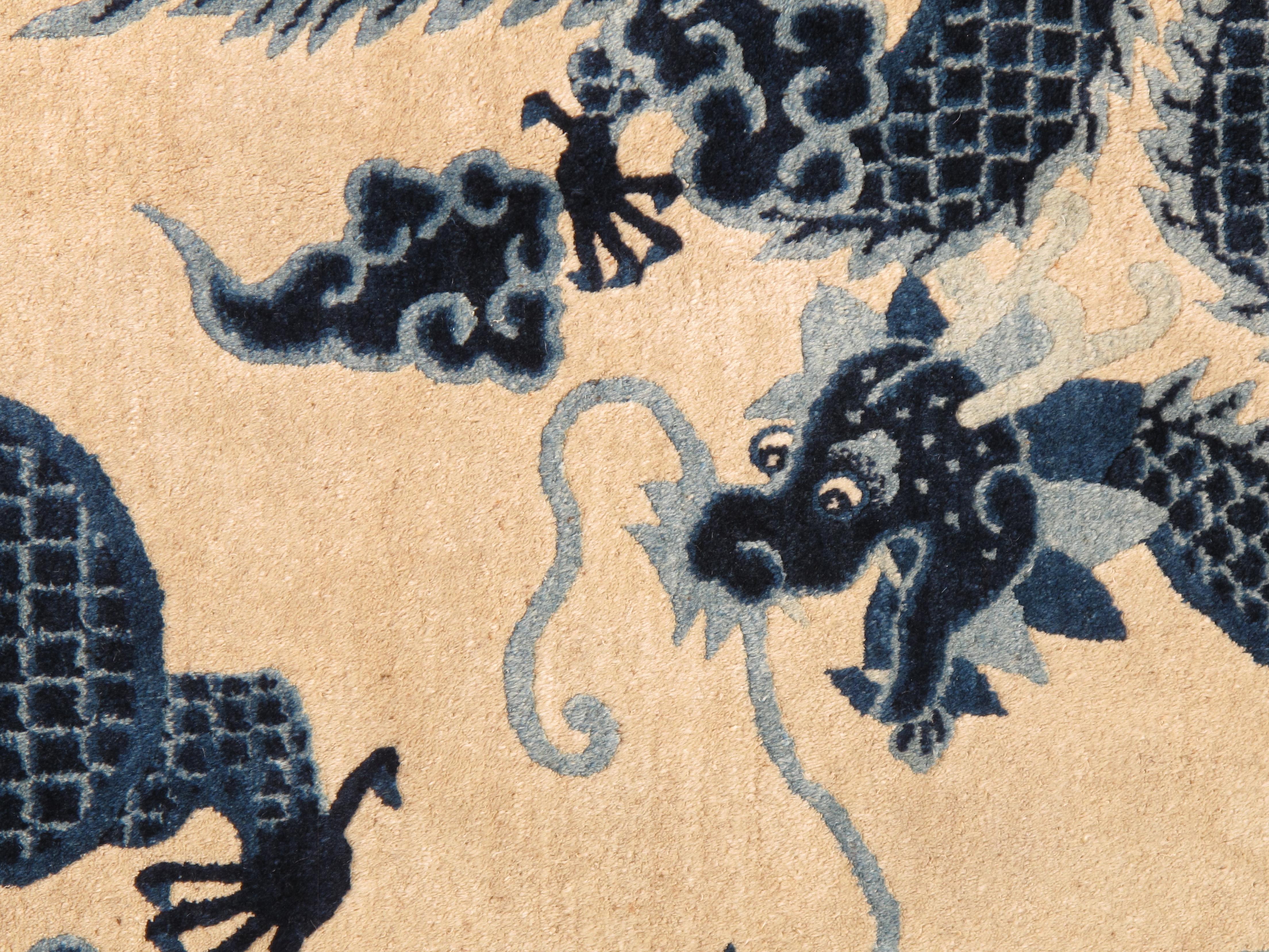 The history of Antique Peking Chinese carpets adorned with five dragons is a captivating journey that intertwines the realms of art, culture, and tradition.

Originating in the imperial workshops of Beijing, these carpets emerged during the late