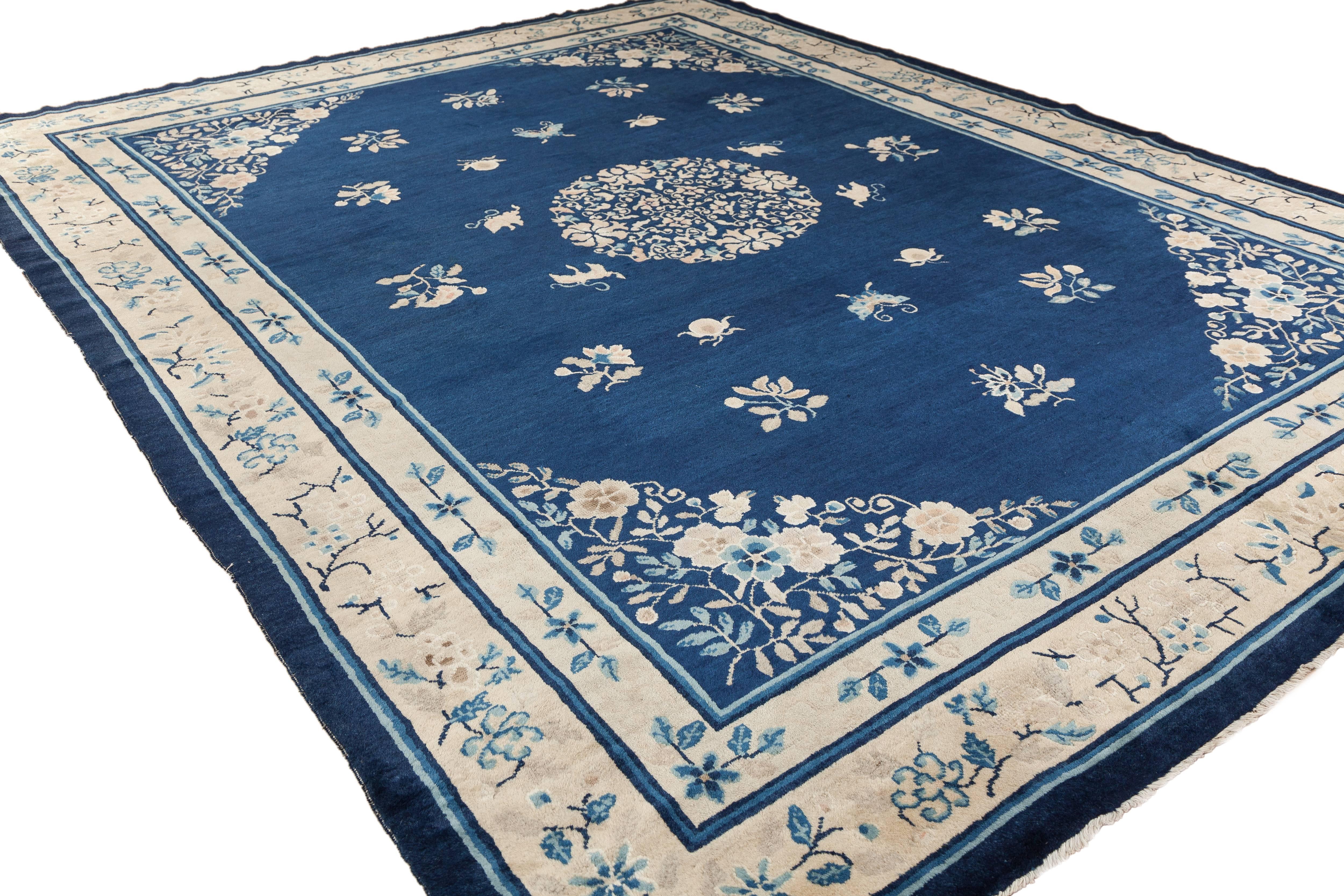 A Peking Chinese rug from China, dating to circa 1910. This piece features Classic restrained balance and color.