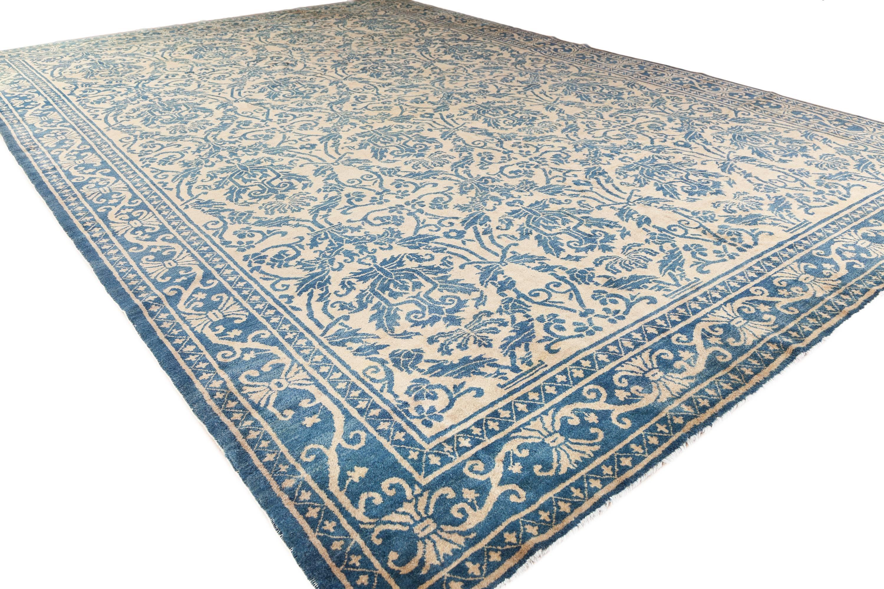 An antique Peking Chinese rug of a classic Hispano-Moresque design, from the first quarter of the 20th century. Both classic and contemporary with a very interesting blue and ivory design.