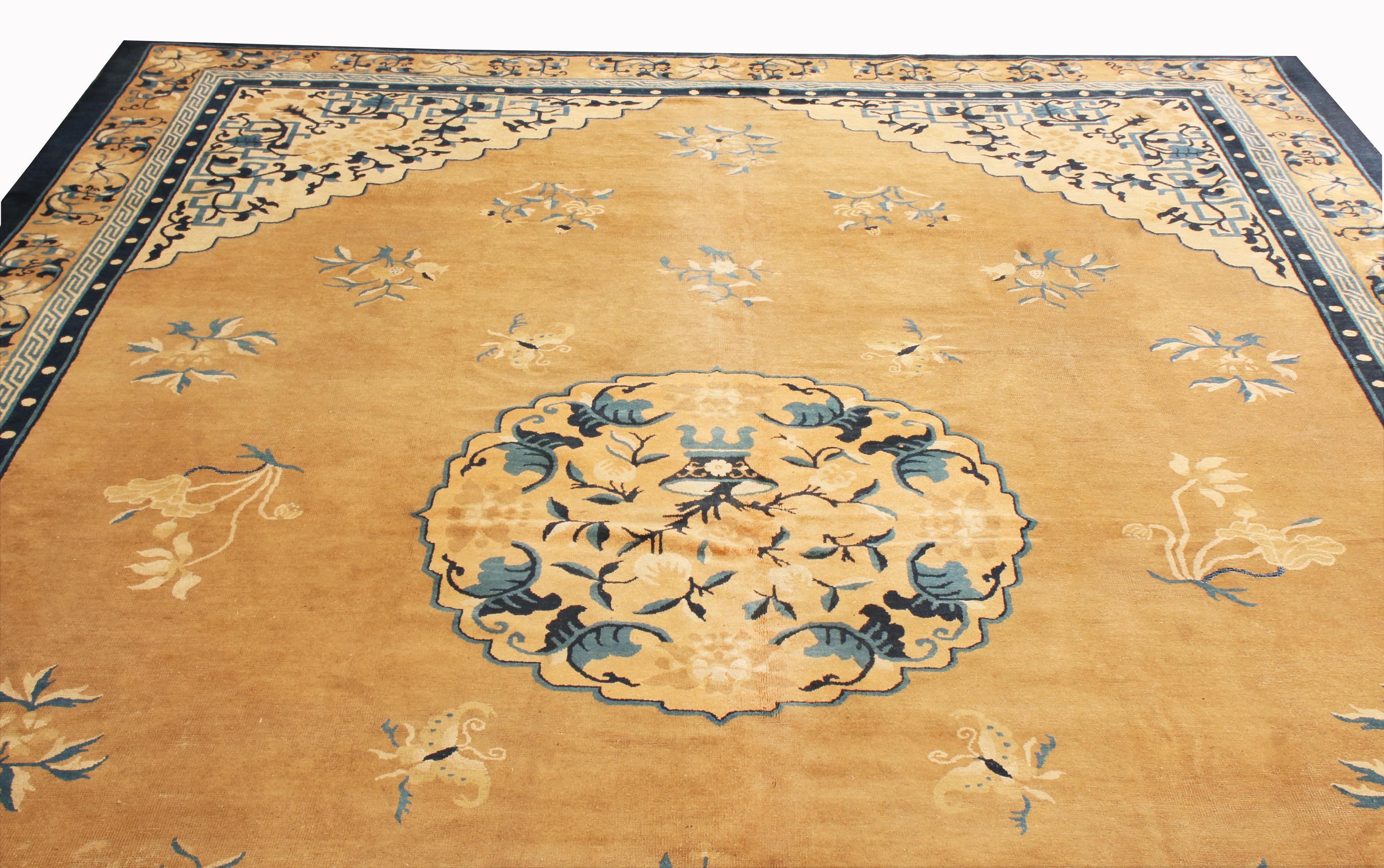 Originating from China in 1910, this antique Peking rug enjoys a rich and varied combination of ornate colourways with Art Deco reminiscent floral patterns. Hand knotted in high quality wool, the medallion field design depicts a highly stylized