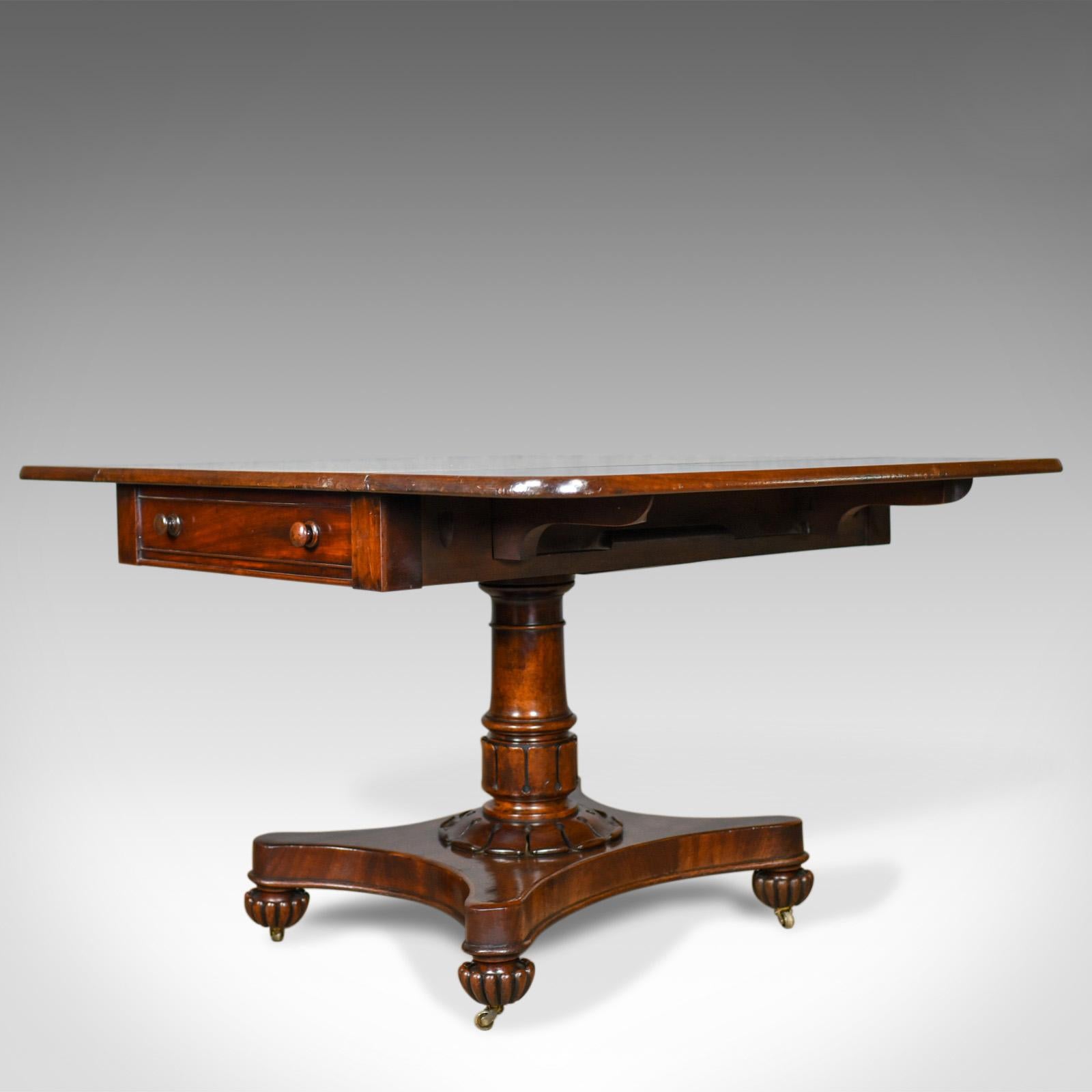 This is an antique Pembroke table, an English, William IV, mahogany sofa table dating to the early 19th century, circa 1835.

The select mahogany displays good, rich, consistent color
Grain interest with appealing tonal qualities
Desirable aged