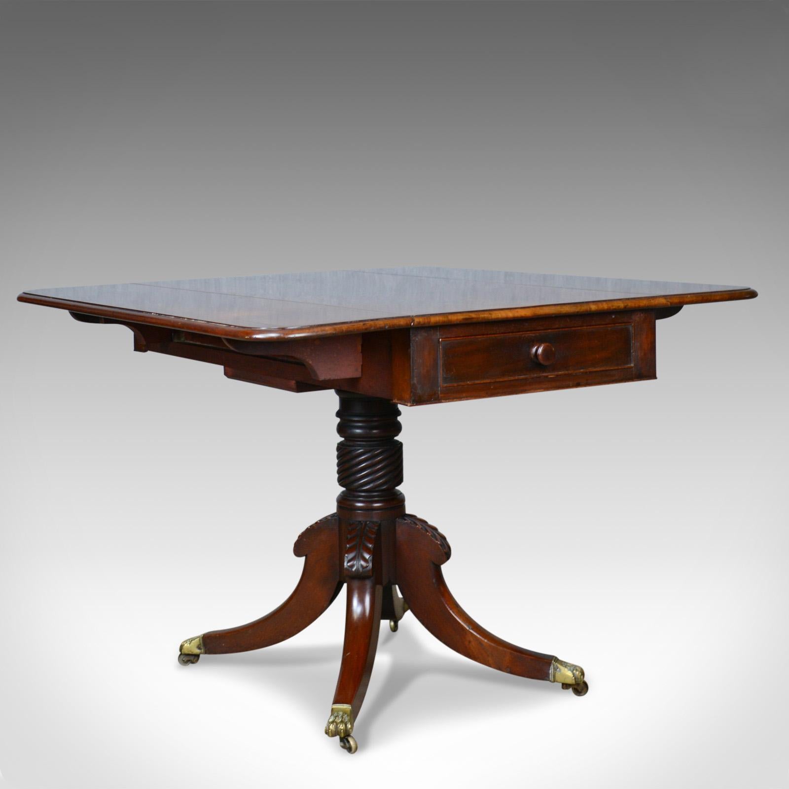 This is an antique Pembroke table in mahogany. An English, Regency drop flap dining table dating to the early 19th century, circa 1820.

Fine example in select mahogany with attractive mid-tone palette
Grain interest with desirable aged
