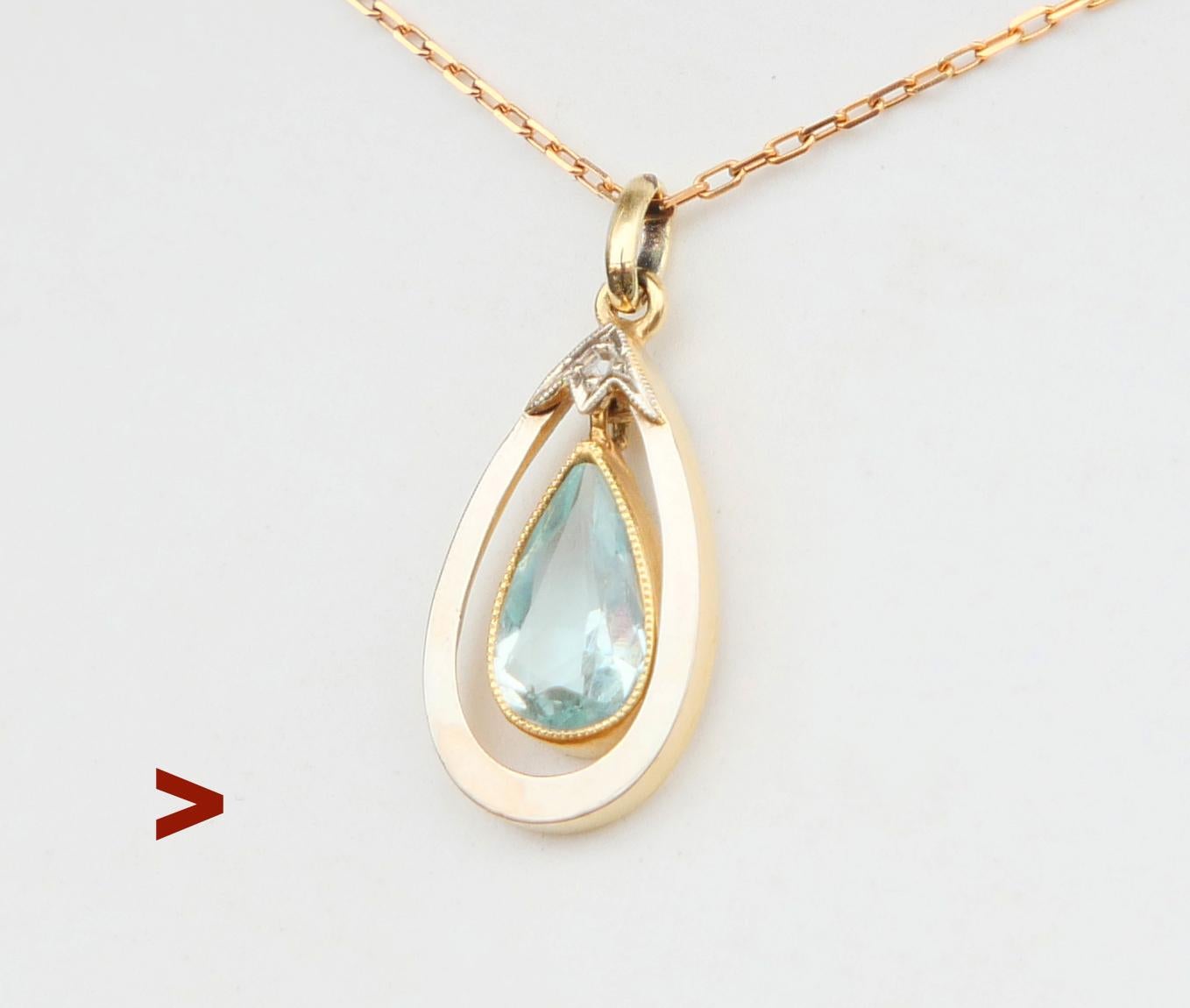 Ca. 1920s -1930s  German pendant in solid 582 Yellow  Gold with freely suspended natural bezel set pear cut Aquamarine accented with a rose cut Diamond in White Gold Setting.

Hallmarked with maker's marks and 582.

Measures :  25mm long including