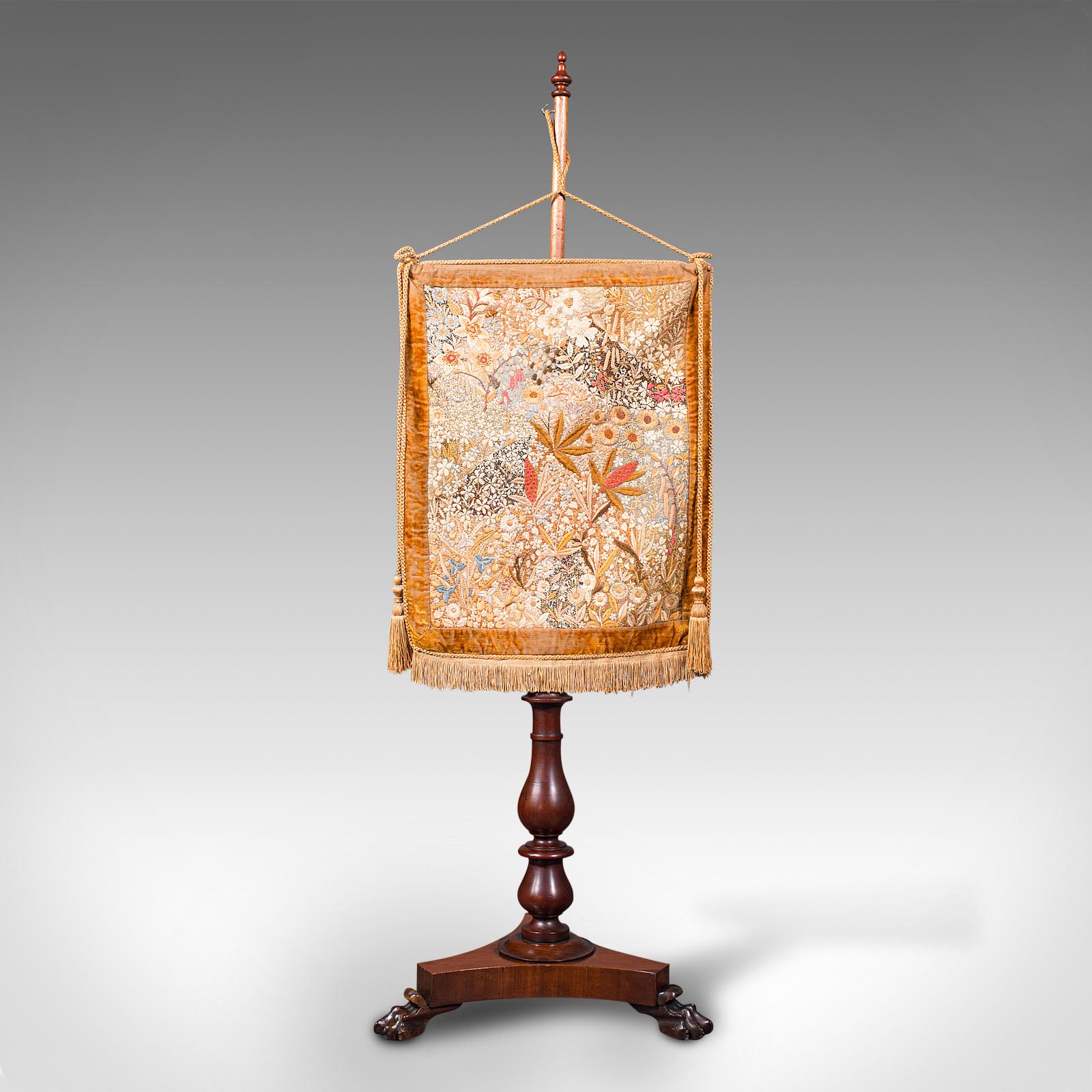 This is an antique pendant pole screen. An English, mahogany and silk cotton fireside tapestry stand, dating to the William IV period, circa 1835.

Striking example of fireside display furniture
Presents a desirable aged patina and in good