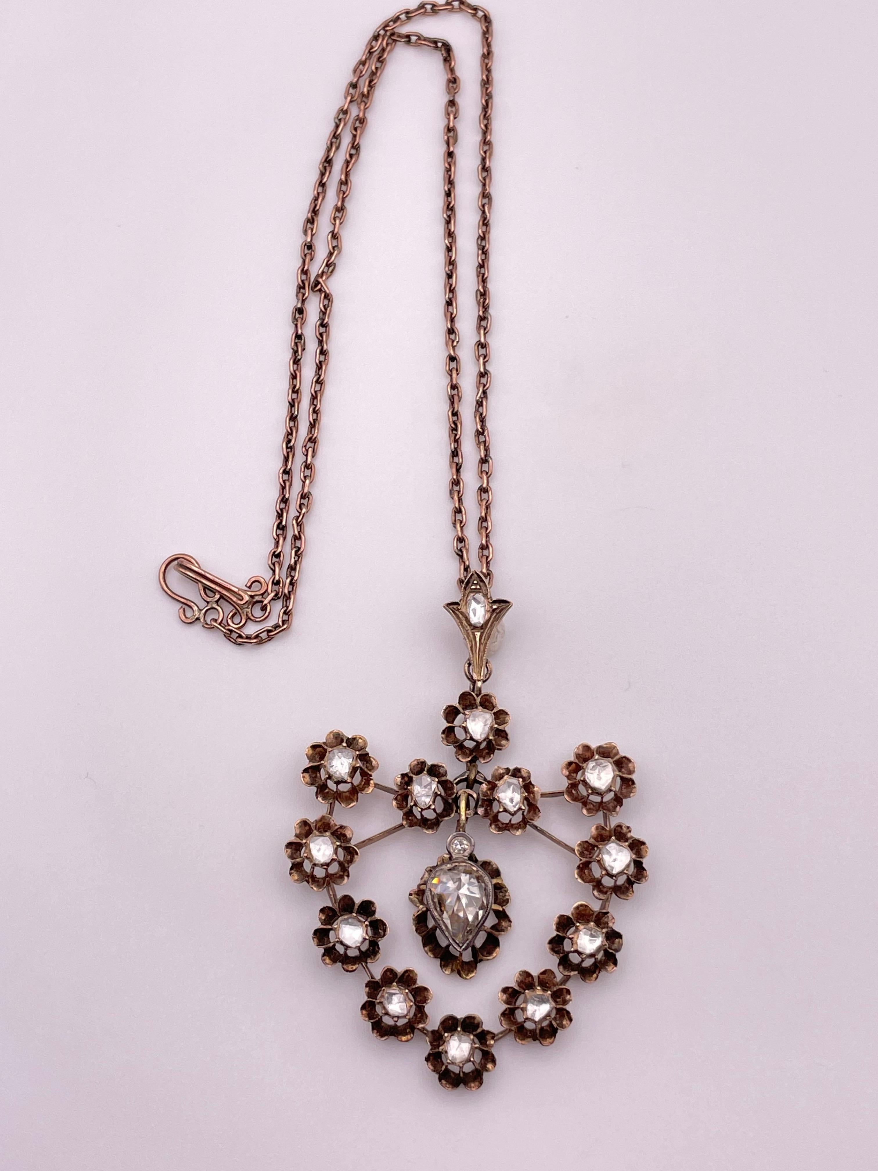 Rose Cut Diamonds Pendent With Hand Made Chain.
The Central Diamond is 1.65 Carats And Total Diamonds are Around 0.70 Carat , 14 Karat Gold