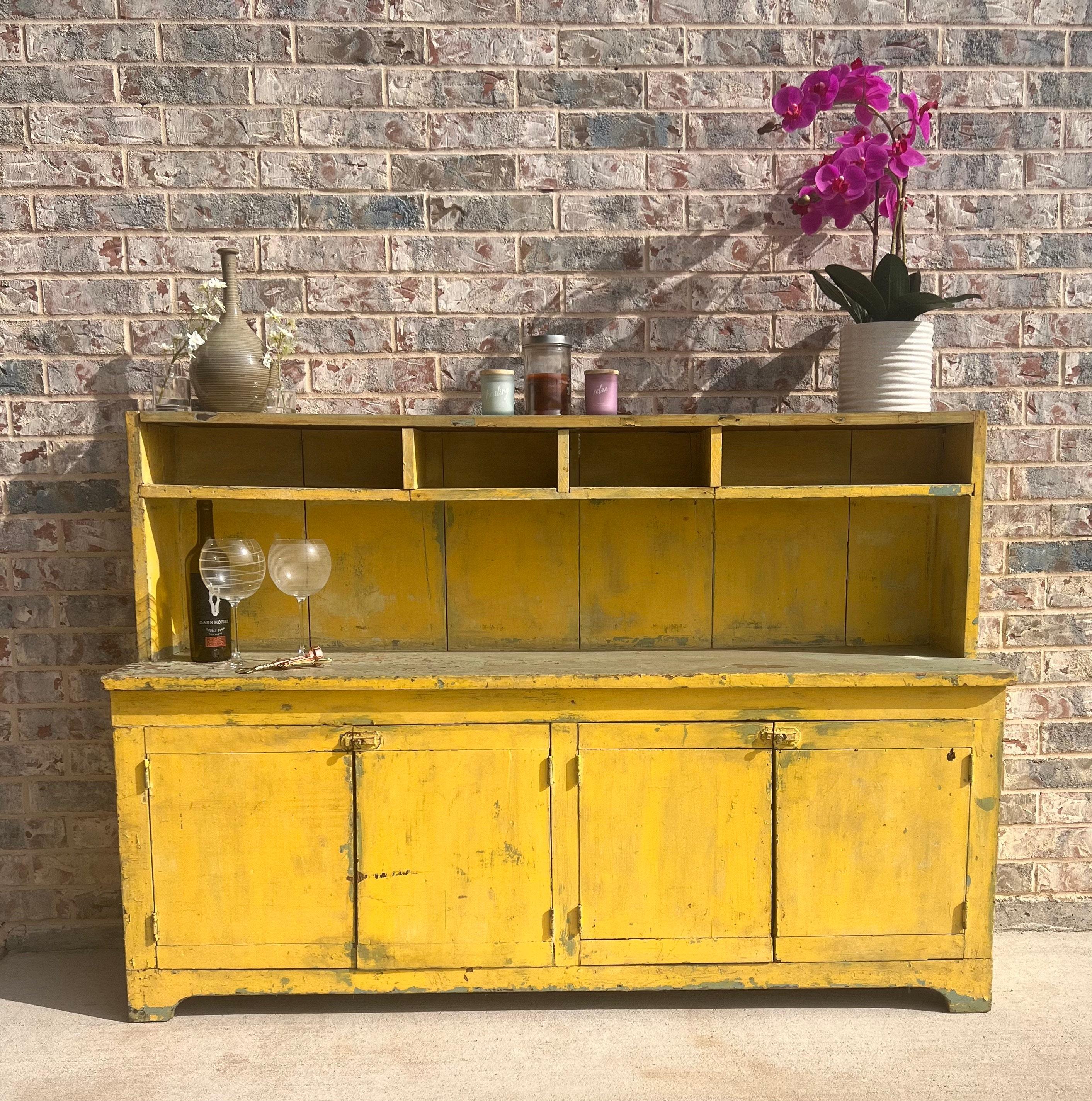 A charming rustic antique American country yellow painted pine bucket bench / kitchen cupboard that today would serve well as a farmhouse sideboard server or breakfast buffet, hall console, patio potters table or work bench, or placed in the foyer