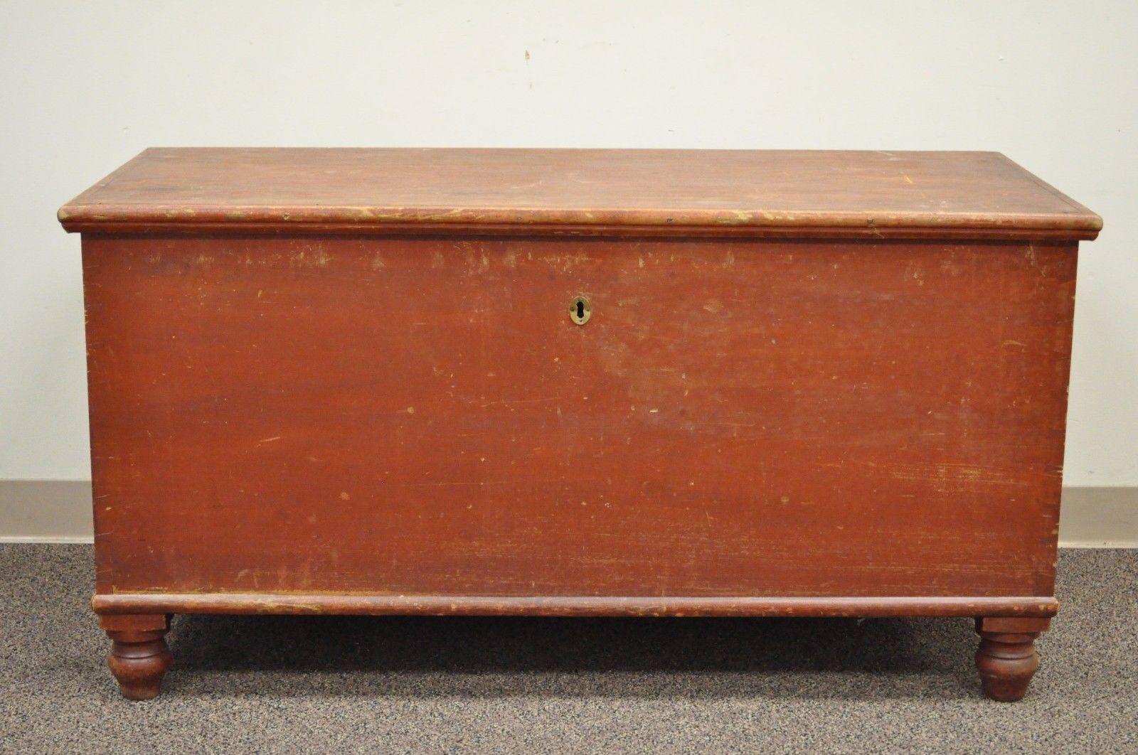 Antique hand dovetailed red painted primitive blanket chest from Pennsylvania. Item features hand dovetailed construction, distressed red paint, bun feet, authentic antique chest, circa late 19th century, PA. Measurements: 25.5