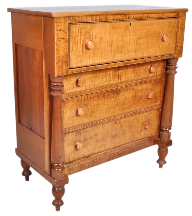Antique Pennsylvanian 'Tiger Maple' chest of drawers, circa 1840. The chest made of the finest figured maple, the top having one overhanging drawer supported with turned cherry columns with a set of three graduated drawers below standing on turned