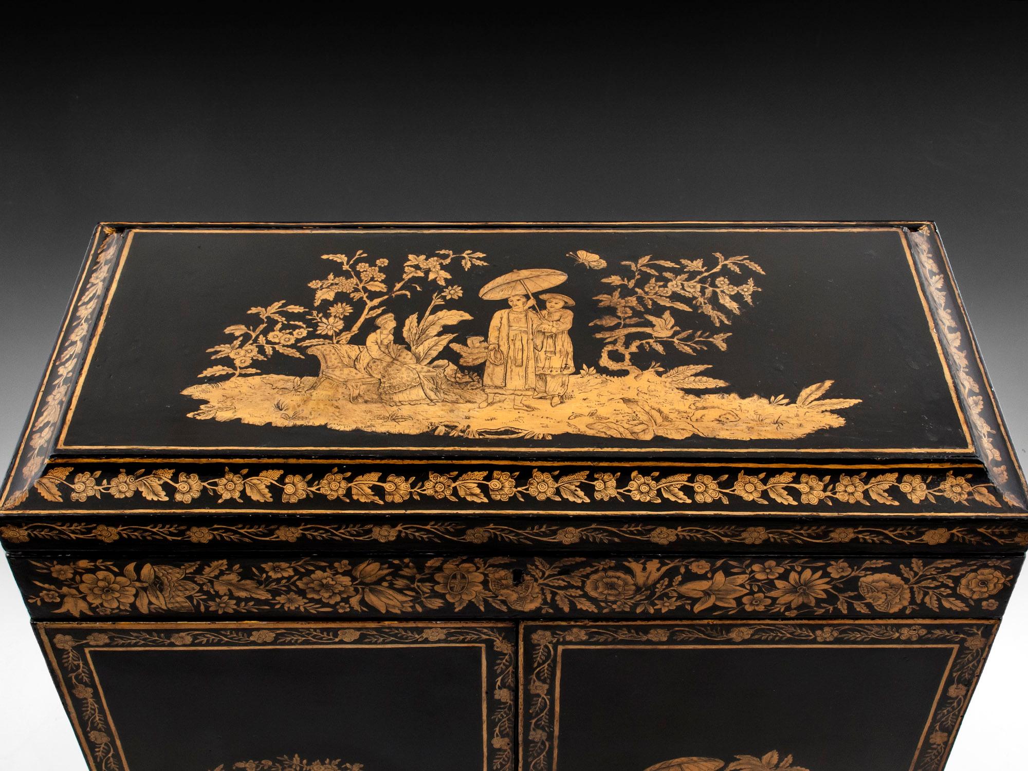 Antique Penwork cabinet, beautifully decorated with Chinioserie figures, landscapes and flowers, and containing a plethora of Grand Tour treasures. Lifting the lid reveals a red velvet compartment and original mirror plate. The doors open to reveal