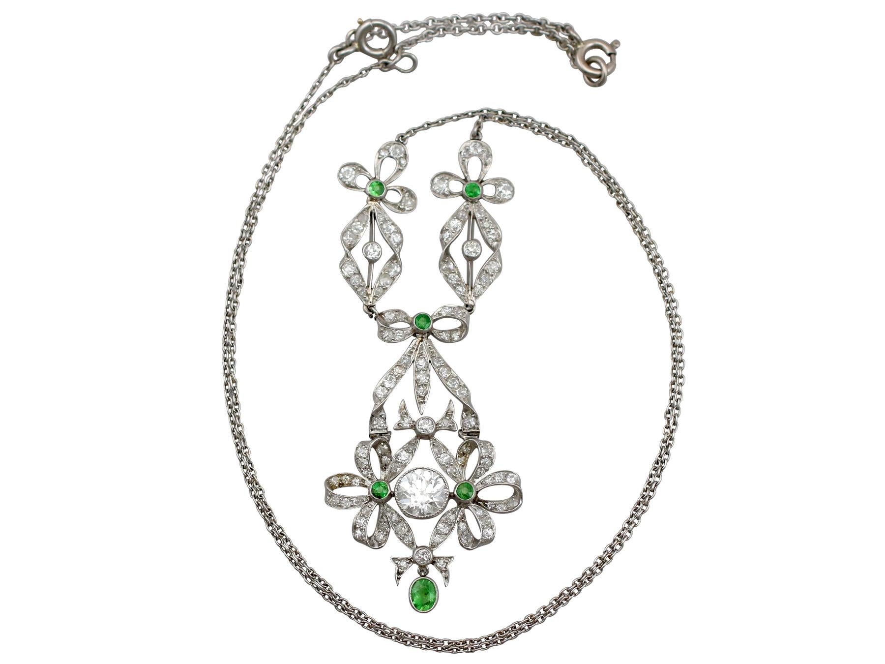 A stunning, fine and impressive antique 2.53 carat diamond and 0.15 carat peridot, platinum pendant; part of our diverse antique jewelry and estate jewelry collections.

This stunning, fine and impressive antique peridot pendant has been crafted in