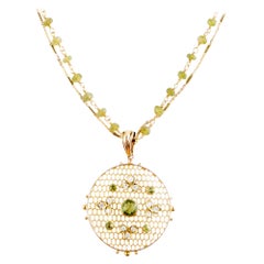 Colgante antiguo de peridoto y diamantes