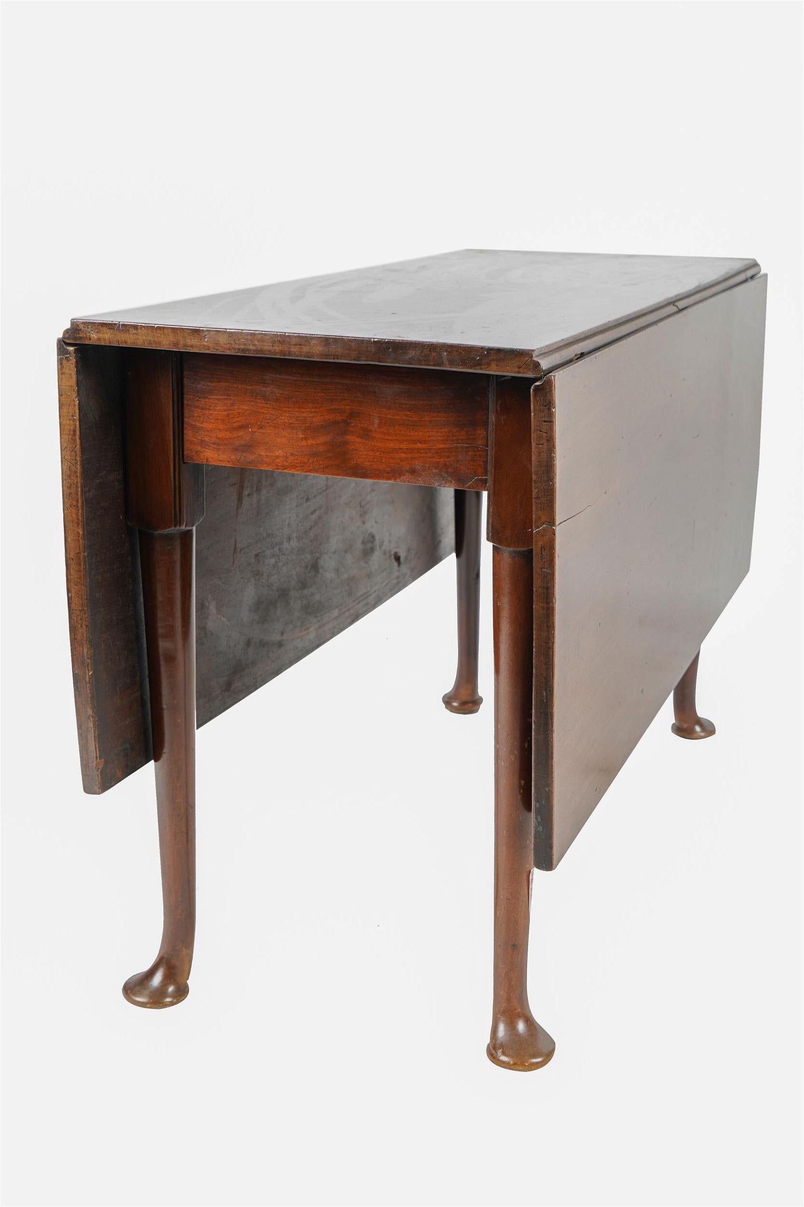 Late 18th Century English Queen Anne Style Mahogany Drop Leaf Table - the hinged top opening to rest on gate legs - 17 inches wide (closed); 51 1/2 inches wide (fully extended); 44 1/4 inches deep; 27 1/2 inches high