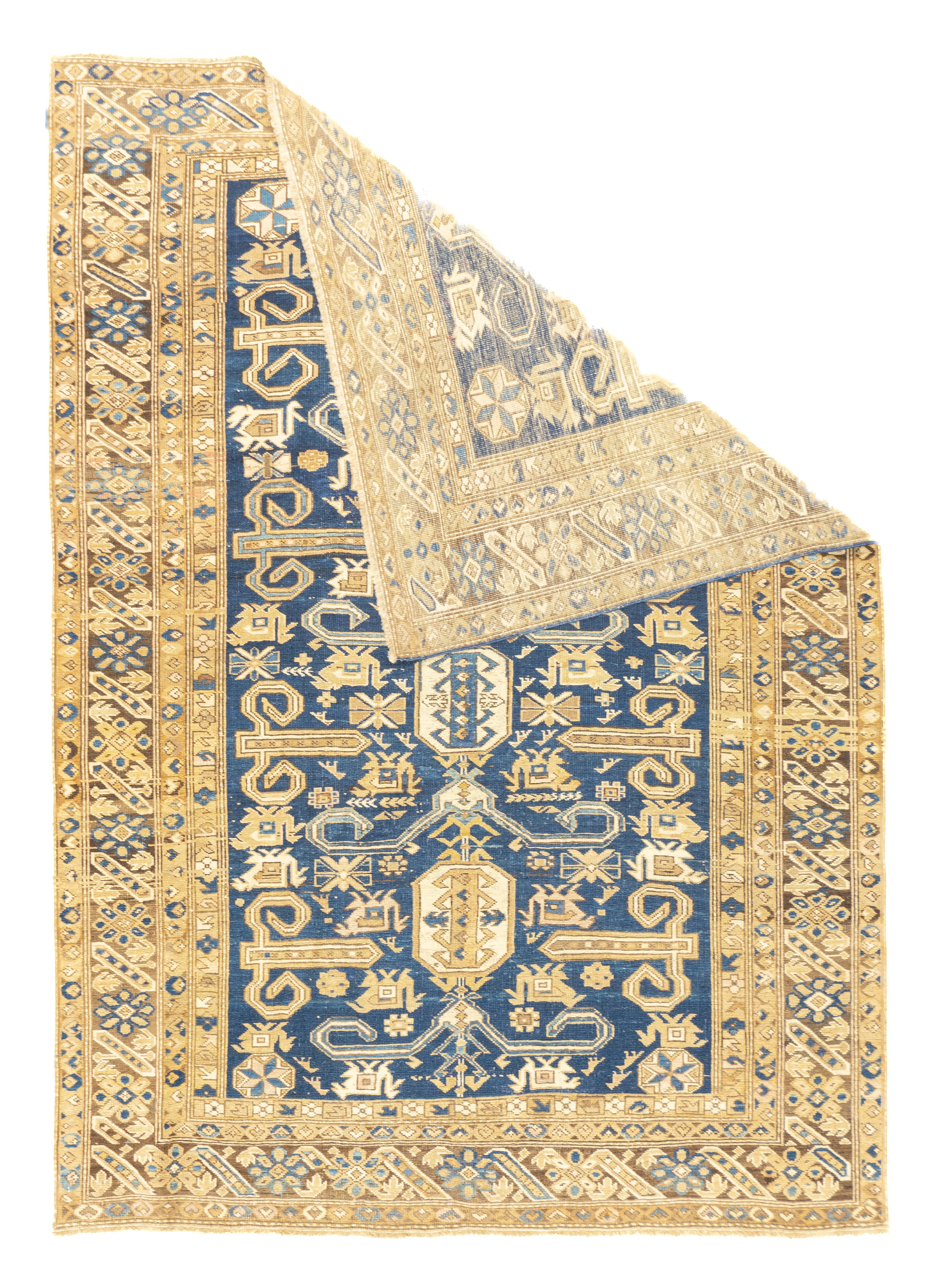 Antique Perpedil Rug 4'8'' x 6'6''. Generally in scatter sizes, from eastern Caucasus, all wool; geometric small scale patterns. A Kuba sub-type. Usually dark blue or cream grounds. A few prayer rugs. 