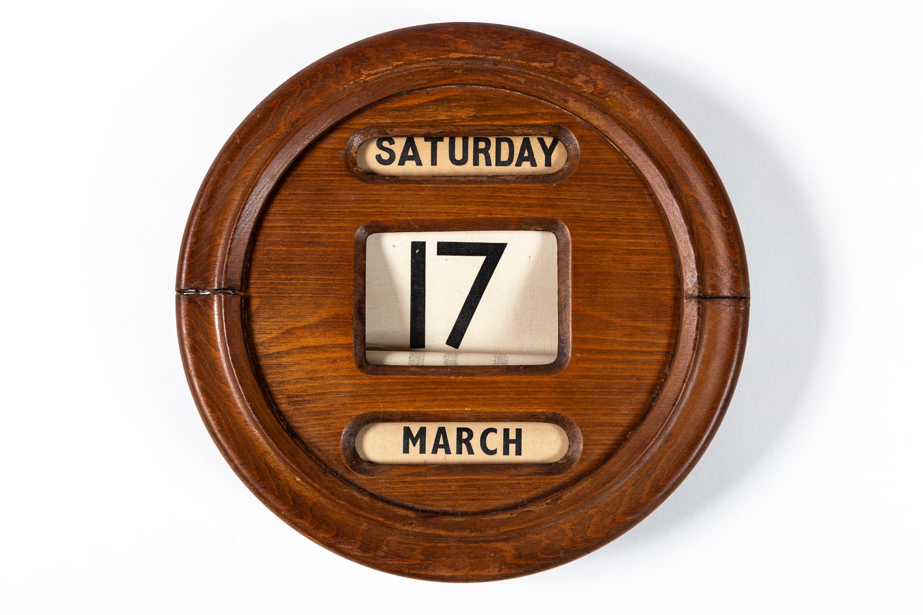 Antique Perpetual Wall Calendar, England, circa 1910. Linen date spools display day, date and month. Wood turned adjusters. Typically used for banks or offices.