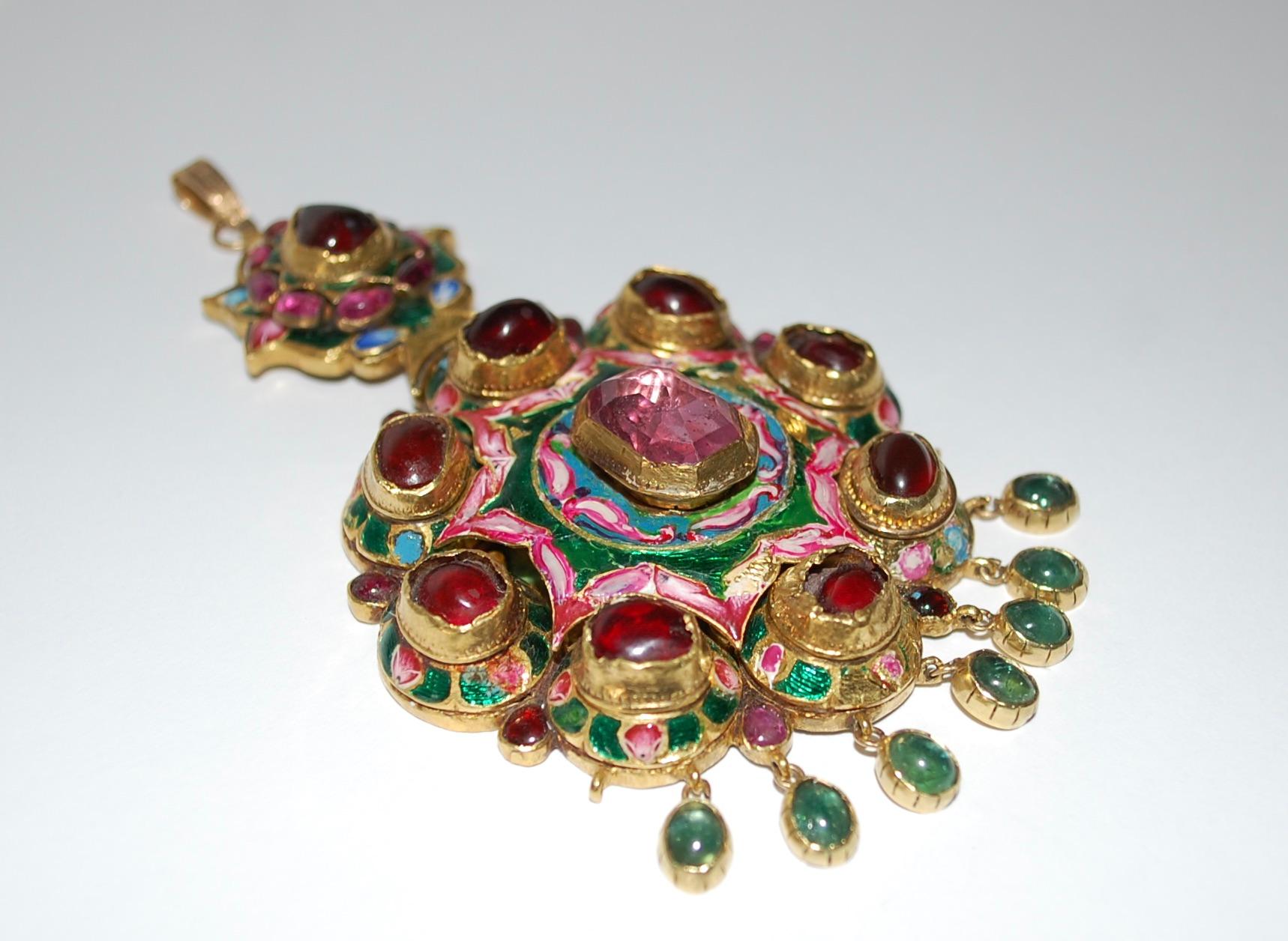 Antique 19th Century Persian 22K Gold Qajar Enameled Gem Set Gold Pendent
Rare and stunning large 22k yellow gold hand made pendant with jewels. 
The pendant is bezel set with one emerald cut genuine natural pink Sapphire. 
The Sapphire measures