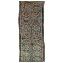 Tapis persan antique Afshar fait à la main en laine bleue avec motif géométrique sur toute sa surface