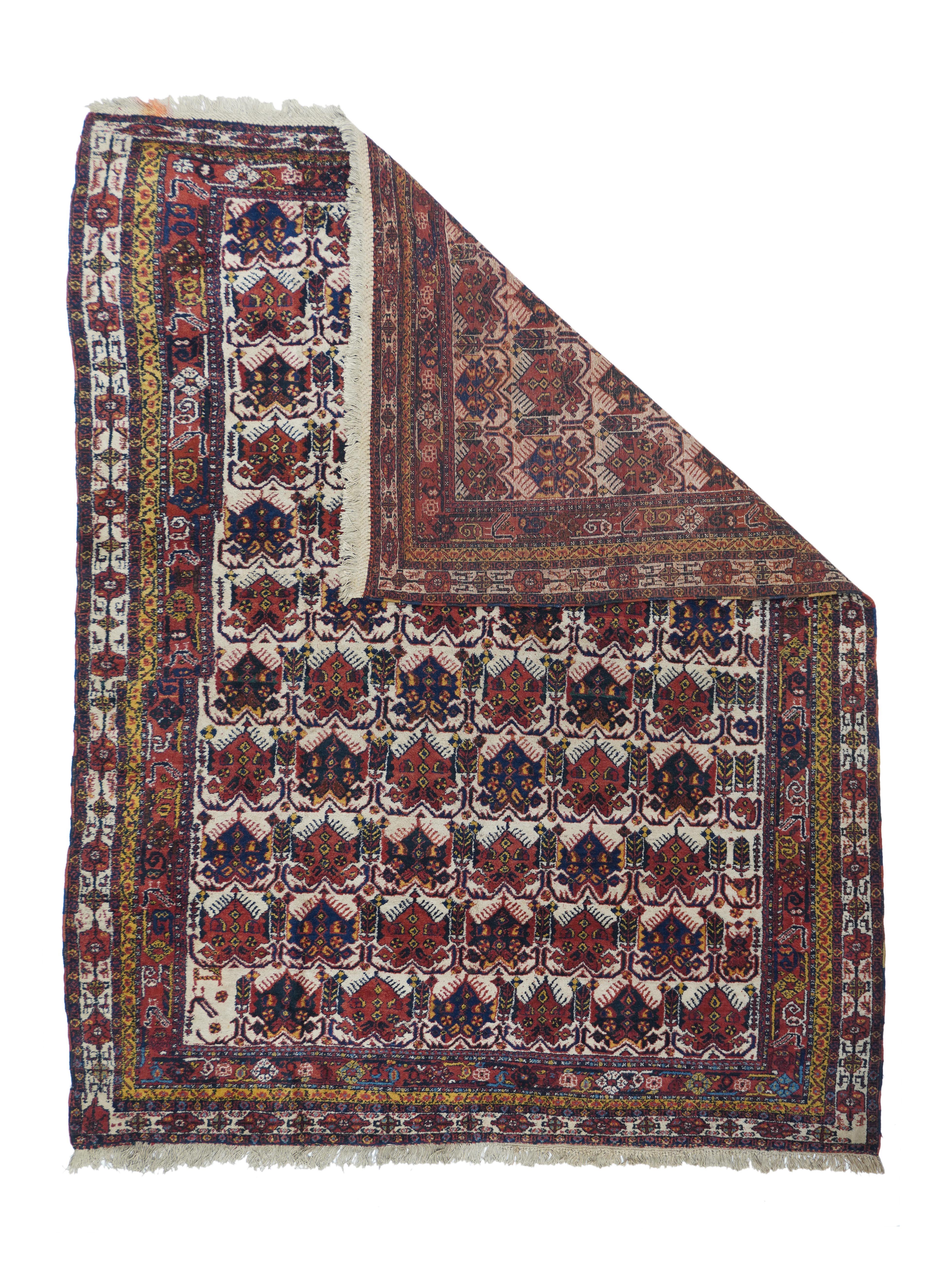 Antique Afshar Rug 4'11'' x 6'6''. The natural ecru field shows 11 rows of six fringed palmettes each, in a one way layout. Alternating red and navy palmettes, Inner borders adjust at centre of left side. Main ivory border of cartouche chains, and