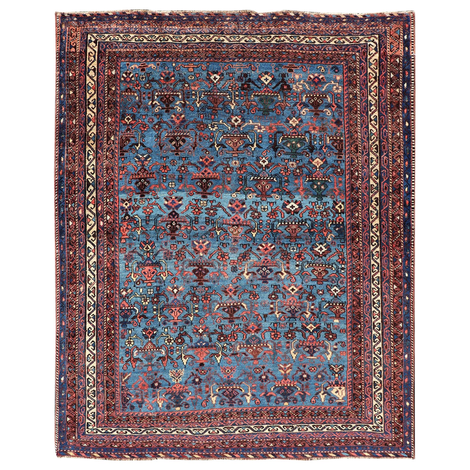 Tapis persan ancien Afshar avec un magnifique fond bleu et des motifs tribaux