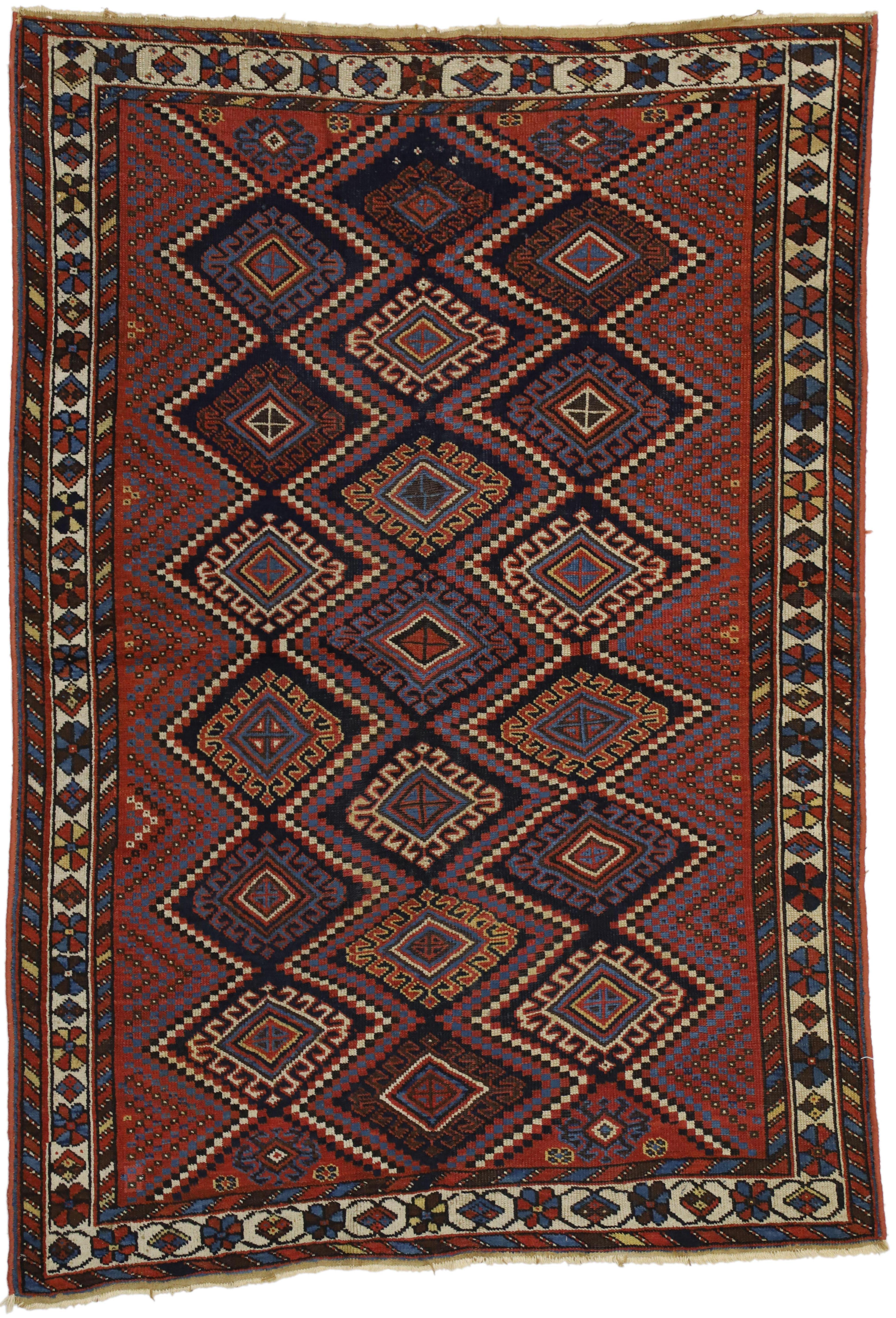 72612 Antique Persian Afshar Rug with Modern Tribal Style. This hand-knotted wool antique Persian Afshar rug with modern tribal style features a lavishly colored composition displaying three stacked rows of repetitive ram’s Horn and hands on hips