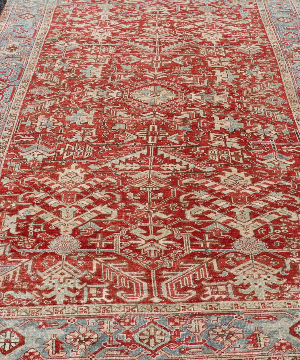 Antique Persian all-over Heriz rug with all-over geometric design in soft red and blue. Keivan Woven Arts / Rug / EMB-9630-P13578, country of origin / type: Iran /Heriz, circa 1920

Measures: 7'6 x 11.