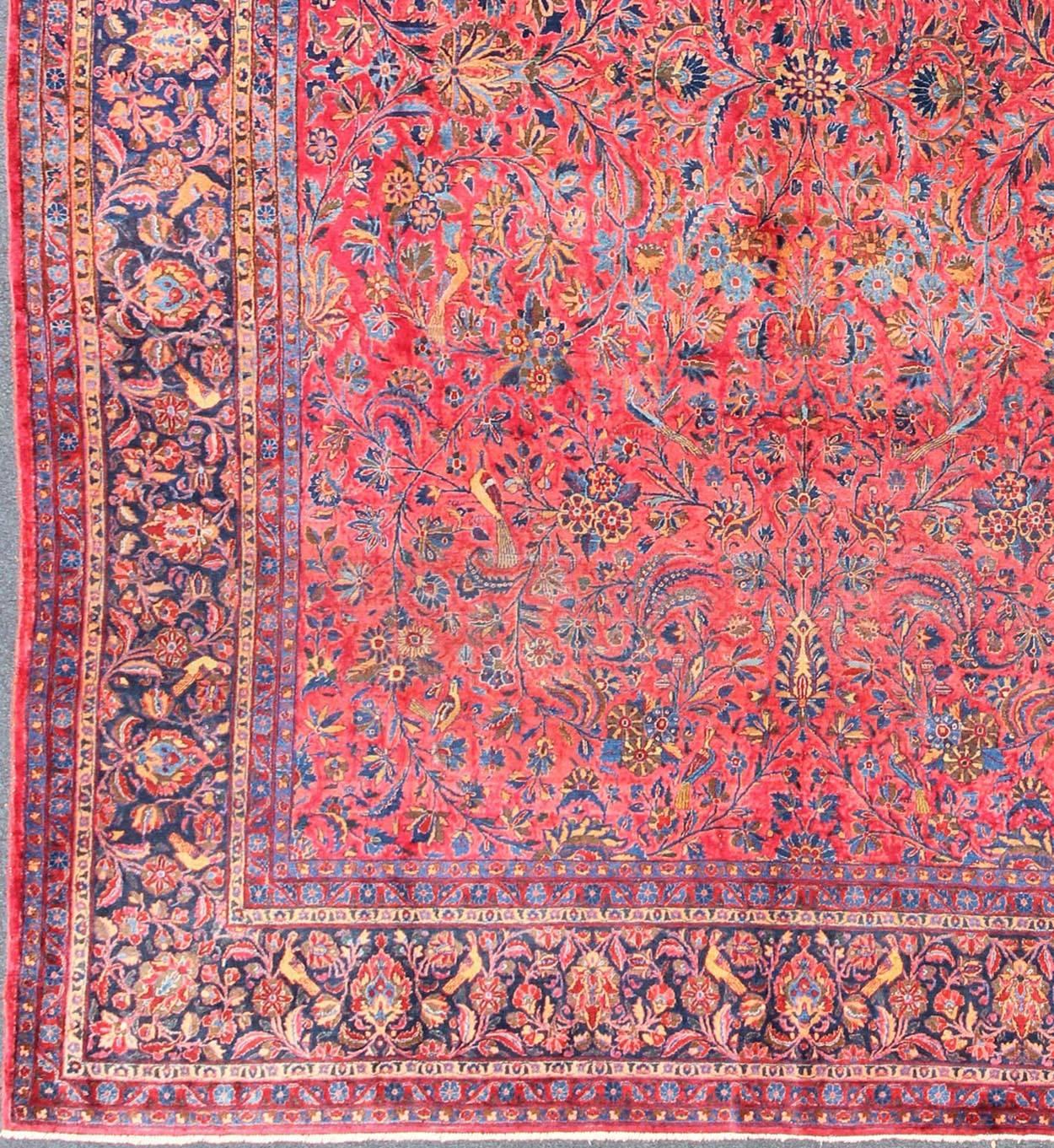 Antiker persischer Kashan-Teppich mit All-Over-Design auf rotem Feld und blauer Bordüre.  Keivan Woven Arts / Teppich H8-0102, Herkunftsland / Art: Persisch / Kashan, ca. Anfang 20. Jahrhundert. 
Maße: 10'6'' x 13'10''.
Dieser antike Kashan-Teppich
