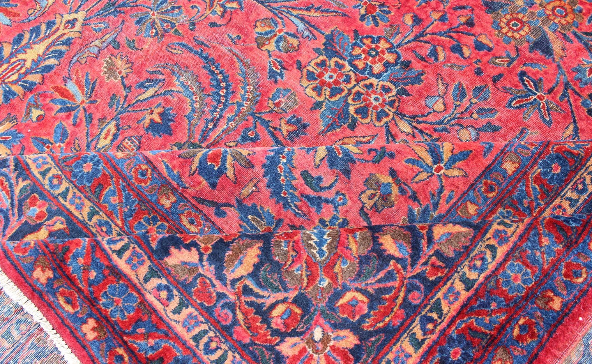 Antique Persian Kashan Rug With a All-Over Design On A Red Field and Blue Border In Good Condition For Sale In Atlanta, GA