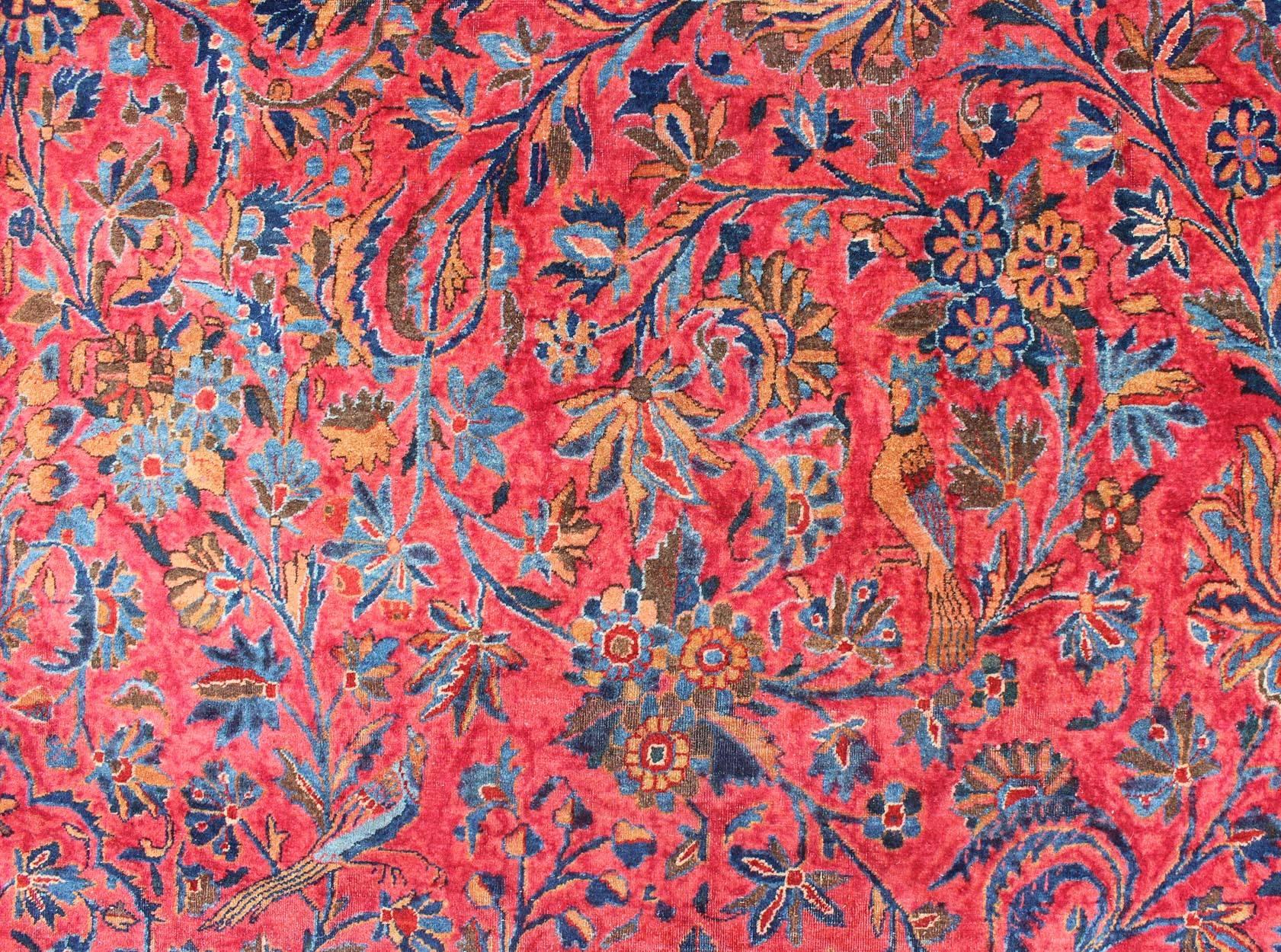 Wool Antique Persian Kashan Rug With a All-Over Design On A Red Field and Blue Border For Sale