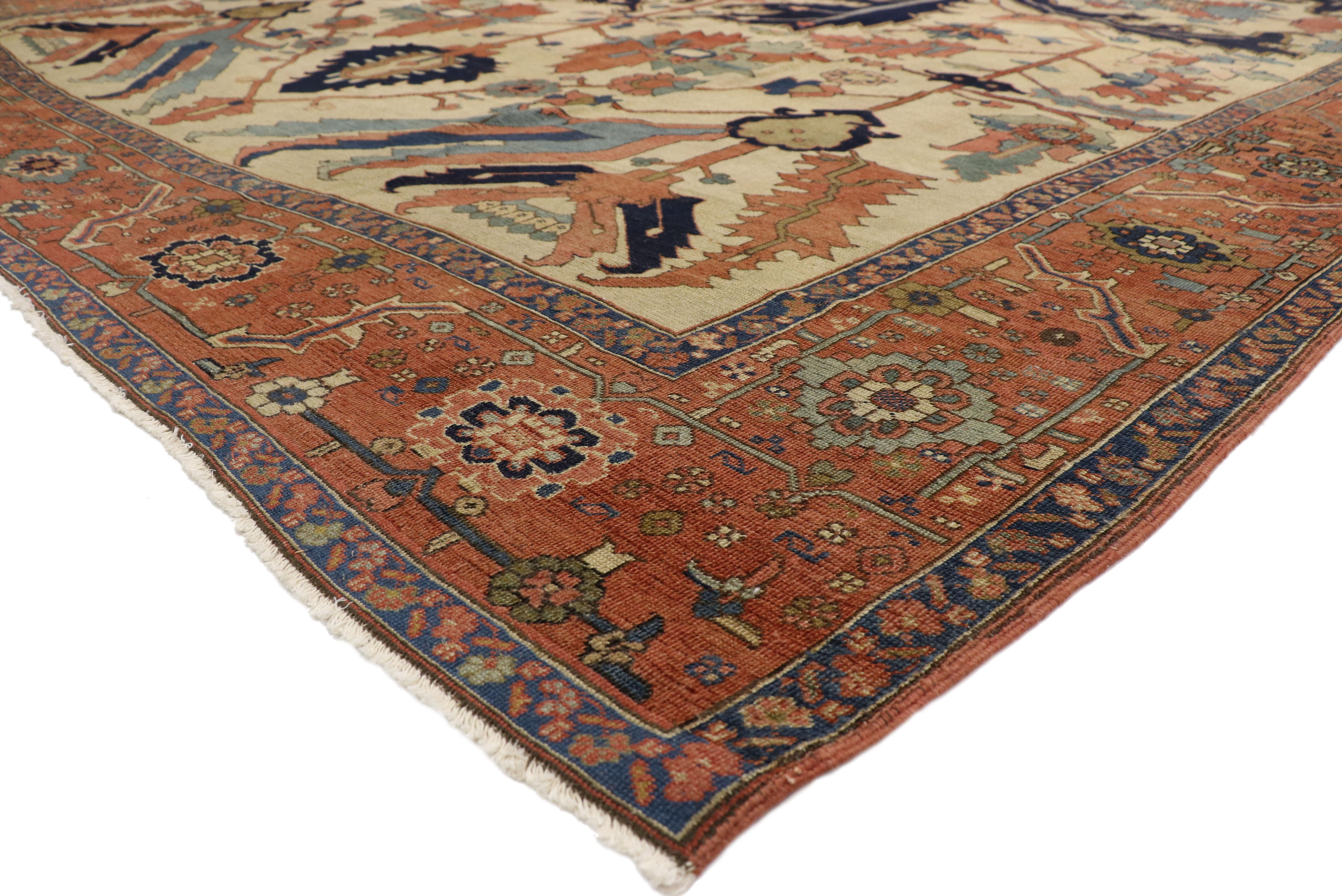 76927 antique Persian all-over Serapi rug with English Tudor style. With a warm, neutral color palette, striking appeal, and architectural design elements, this hand knotted wool Tudor style antique Persian Serapi rug can beautifully blend