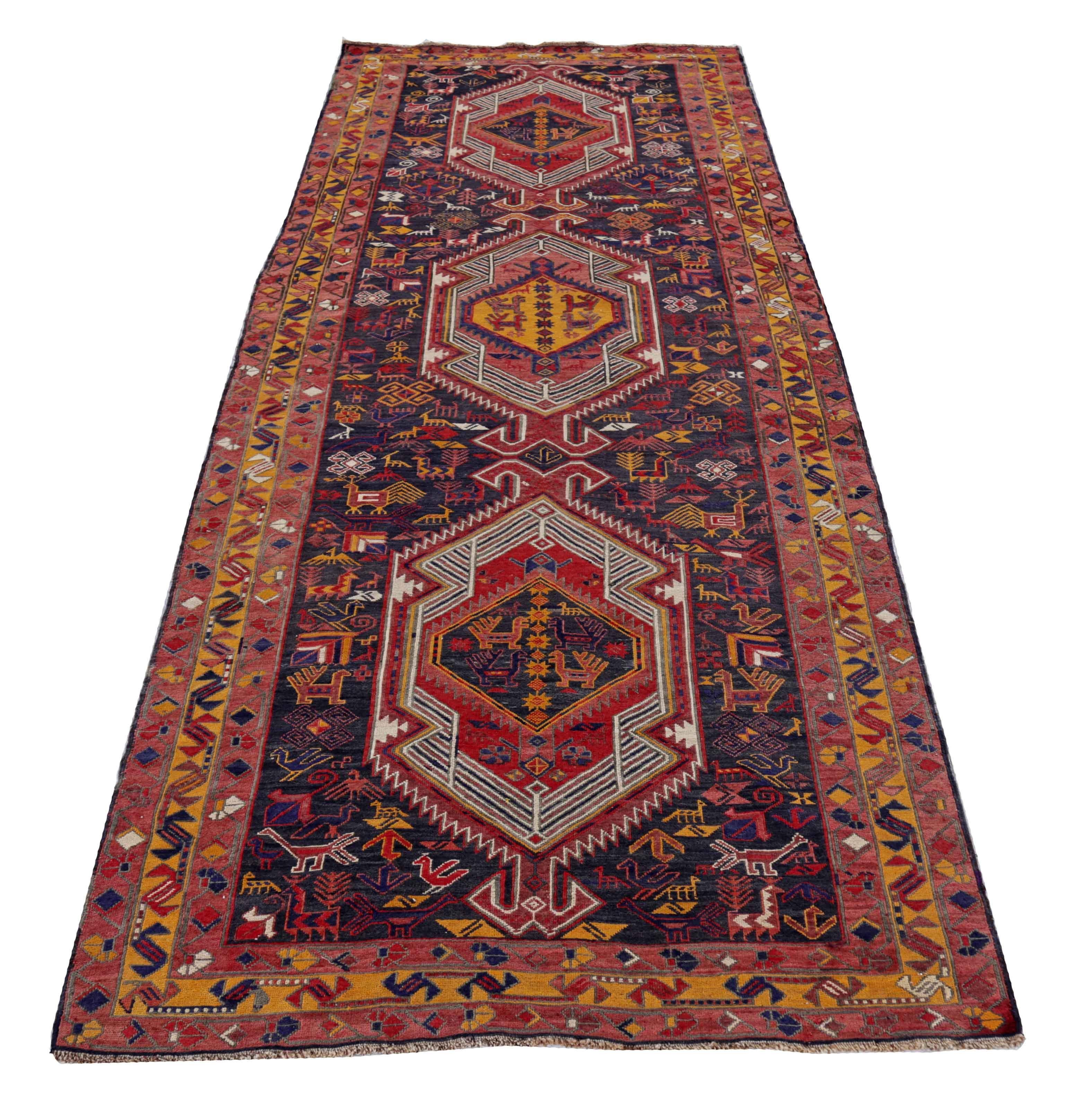 Antique Persian area rug handwoven from the finest sheep’s wool. It’s colored with all-natural vegetable dyes that are safe for humans and pets. It’s a traditional Azerbaijan design handwoven by expert artisans. It’s a lovely area rug that can be