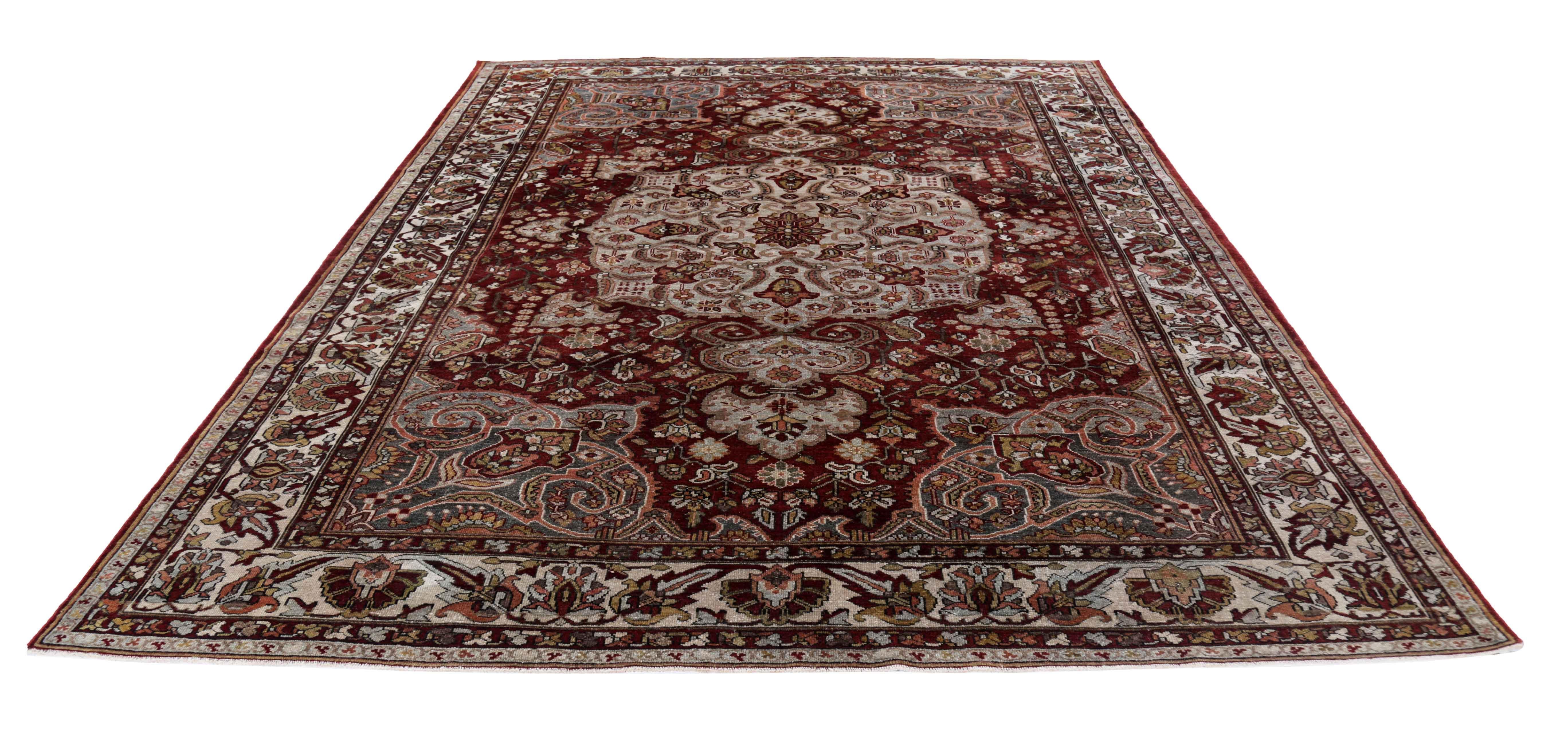 Antique Persian area rug handwoven from the finest sheep’s wool. It’s colored with all-natural vegetable dyes that are safe for humans and pets. It’s a traditional Bakhtiar design handwoven by expert artisans. It’s a lovely area rug that can be